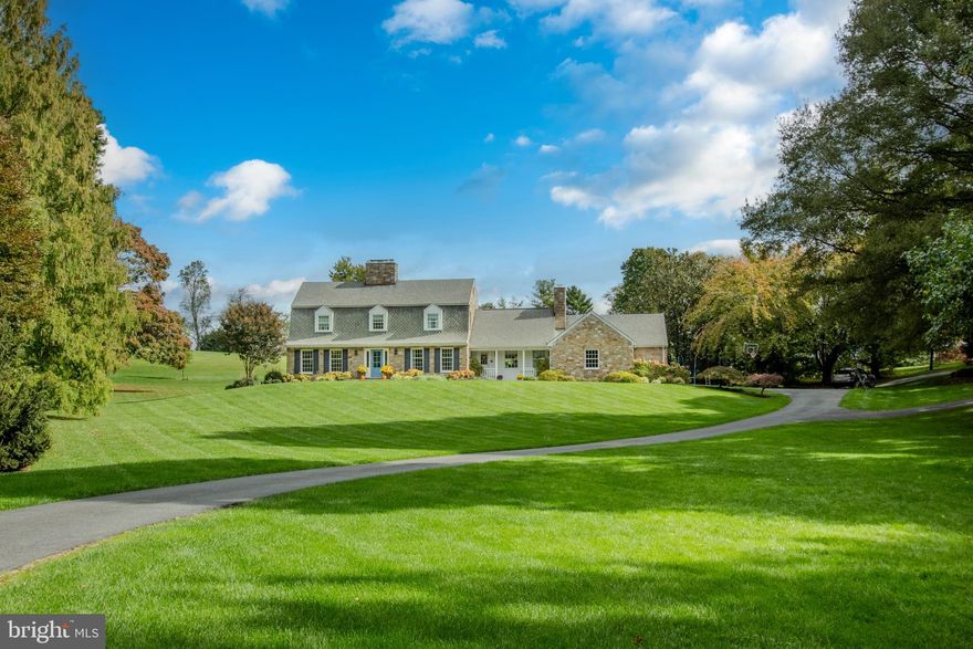 Indulge in the pinnacle of luxury living with this exquisite 4-bedroom, 2.5-bath Colonial residence, gracefully influenced by Dutch architecture, set within the prestigious Glenangus community. Meticulously crafted with over $500,000 in renovations and design enhancements, this home is a true work of art. Nestled serenely, this home sits back off the road, offering a retreat-like feel. As you step through the inviting entrance, you'll be immediately captivated by the foyer's elegance, adorned with crown molding and hardwood floors that gracefully flow throughout the residence. To your left, a generously sized bedroom beckons, featuring charming chair railing, crown molding, recessed lighting, and a cozy gas fireplace. Connected to this bedroom is a versatile bonus room, providing endless possibilities to suit your lifestyle. The family room is a cozy retreat, boasting coffered ceilings, yet another gas fireplace, and a slider that opens onto the outdoor patio, creating a seamless indoor-outdoor living experience. The adjacent half bath is adorned with wainscoting and a marble vanity. The nearby dining room is a true gem, offering built-in display cabinets with a convenient countertop and drawers for storage, making it the perfect cocktail station for entertaining. A thoughtfully designed office space with a built-in desk provides a tranquil workspace. The living room, just off the kitchen, showcases its own fireplace and seamlessly connects to the heart of the home. Prepare to be wowed by the chef's dream kitchen, featuring a herringbone backsplash, top-of-the-line Wolf stainless steel appliances, a built-in Miele coffee machine and coffee bar, elegant display cabinetry, and not one but two oversized islands with an overhang for bar stools, all beneath soaring vaulted ceilings. The rear of the home has been expanded with an 800-square-foot addition, adorned with floor-to-ceiling windows that frame breathtaking views of the 17th hole at the Maryland Golf & Country Club. For your convenience, there's a thoughtfully designed mudroom with built-in storage and a dedicated dog washing station. As you ascend to the upper level, you'll discover built-in shelves in the hallway, complemented by a cozy window seat, creating an inviting nook. The primary bedroom suite offers a walk-in closet and a luxurious attached bath with dual vanities. Additionally, the third bedroom features its own walk-in closet and an attached bath, while a fourth bedroom completes the upper level. A well-appointed laundry room with a utility sink, folding counter, and ample storage is conveniently situated nearby. The basement is currently unfinished but includes a rough-in for an additional bathroom, providing endless possibilities for customization. Outside, a charming patio with a built-in fire pit beckons, overlooking the scenic golf course. The backyard also features a mulched playground, perfect for outdoor enjoyment. This property additionally boasts a new insulated shed built in 2020, featuring double doors and currently serving as a home office, with a side garage door for easy access to your golf cart directly from the fairway. You'll also appreciate the convenience of a 2-car attached side-entry garage and a P-shaped driveway with ample space to accommodate up to 6 vehicles. Further enhancing your quality of life, this home includes a whole-home water treatment system, recently upgraded hot water heater, windows, furnace and has been featured on Poppy Home Designs. Please note the current septic system is rated for 3 bedrooms. Enjoy not only the panoramic views of the golf course but also the ultimate in luxury living in this remarkable property, which sits back off the road, offering a private and tranquil oasis.