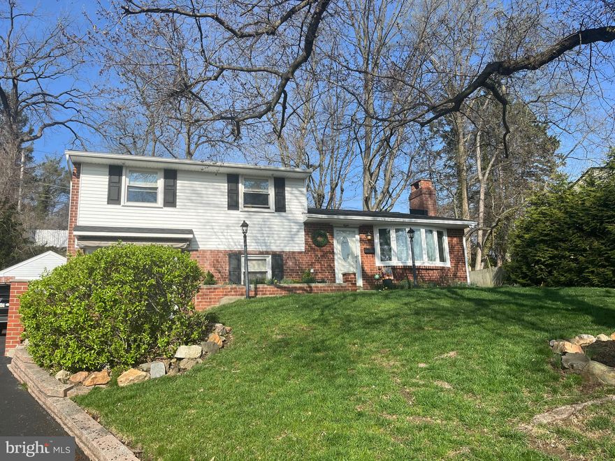 Fabulous Broomall brick colonial in the highly regarded Marple Newtown School District, meticulously updated and ready for you to move right in. Numerous improvements throughout including a renovated kitchen, updated baths, detached one-car brick garage, 2-year-old roof, and a gorgeous four-season sunroom — all set on a beautifully landscaped lot with multiple outdoor living spaces.

Enter into a warm and inviting formal living room featuring hardwood floors and a stunning whitewashed brick gas fireplace — the perfect centerpiece for cozy evenings at home. The updated kitchen features granite countertops, white cabinetry, stainless steel appliances, subway tile backsplash, and a coffered ceiling with recessed lighting — plus a breakfast counter with seating for casual meals. The dining room flows naturally from the kitchen with French doors leading to the large flagstone patio, ideal for outdoor entertaining. Also off the dining room, the four-season sunroom is bright, spacious, and wrapped in windows — perfect as a home office, playroom, or additional living area.

The lower level great room offers fantastic additional living space, with sliders opening to the charming brick-walled front patio — a perfect spot for morning coffee or dining al fresco — plus a laundry area and driveway access to the detached one-car garage. Upstairs you'll find well-sized bedrooms each with ceiling fans. The home now offers 2.5 baths. Hardwood floors and low Marple taxes add even more value to this wonderful offering.

Ideally situated with convenient access to Philadelphia International Airport, Center City, public transportation, and all the shopping and dining that Broomall and the surrounding area have to offer. Easy commuting in every direction makes this location as practical as it is desirable.