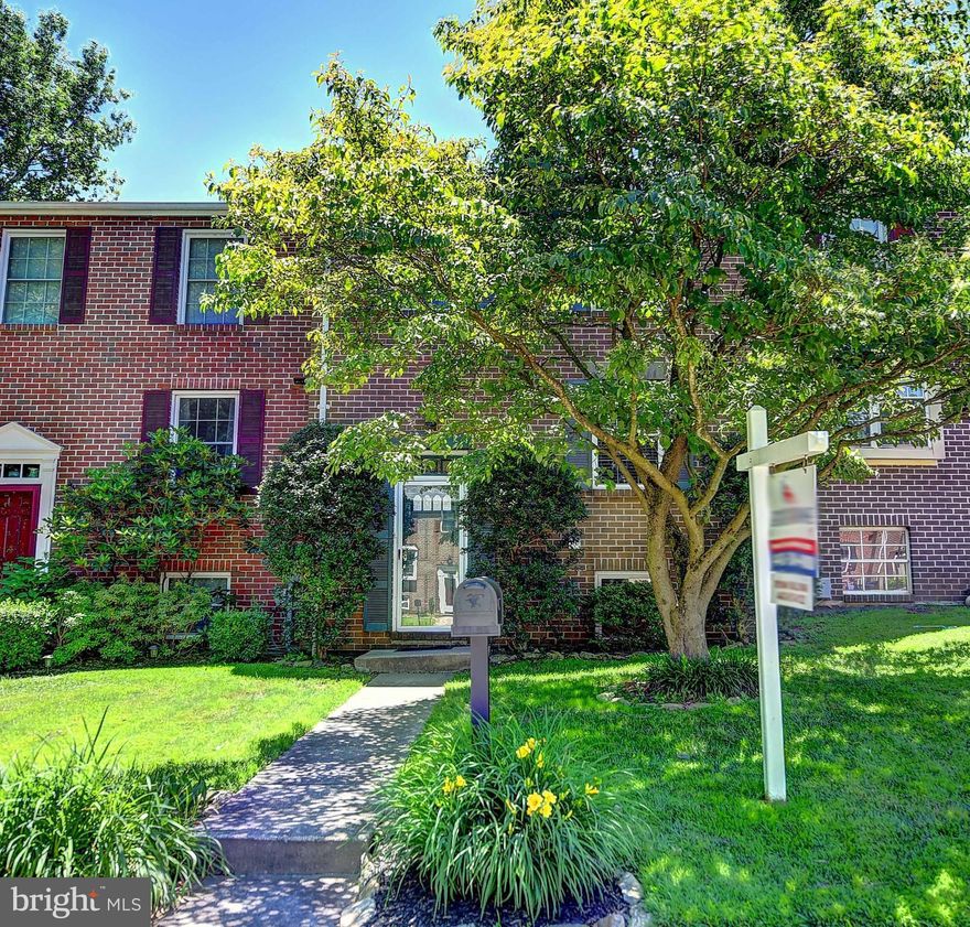 Move-in ready brick-front townhome backing to woods! Master bedroom w/its own full bath feat marble & granite. Addtl two bedrms & full bath upstairs. Designer kitchen w/granite counters & SS appliances. Bright living rm opens to large deck w/scenic view. Cozy up w/wood burning fireplace in fully finished bsmt. Walkout to covered patio, swing, & pond. Newer water heater, HVAC, windows, and siding.