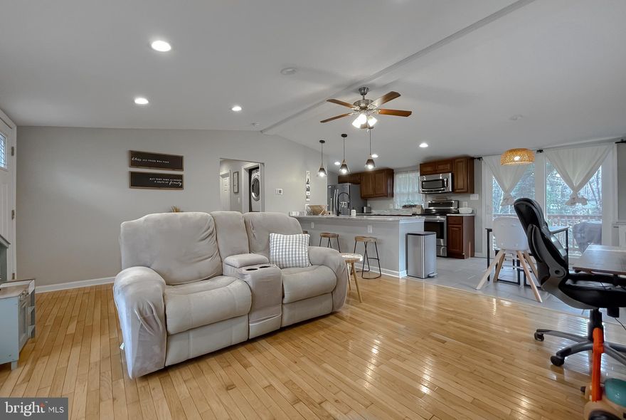 Adorable 3 Bedroom, 2 full bath rambler featuring an open concept kitchen and living room.  Perfect for everyday living and entertaining.  The beautifully remodeled kitchen (2022) showcases granite countertops and modern finishes.  A newer roof and adds peace of mind.  Centrally located with easy access to the community garden, two private beaches, community lake, and nearby shopping.