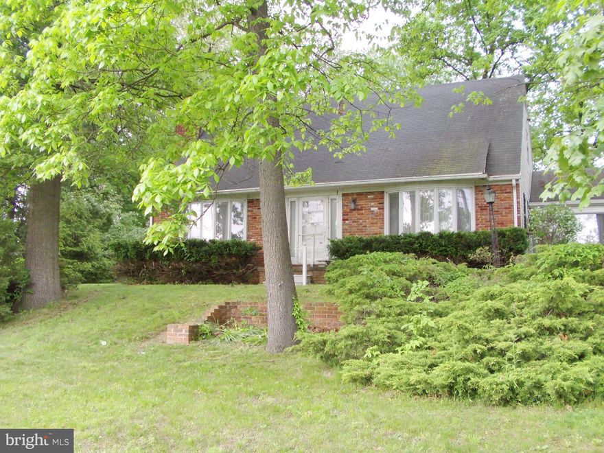 Great commuter location with a Circular driveway, plenty of parking, including a 2-car garage. Huge yard in the rear, very flat and level and open. Large Bedrooms upstairs and lots of character. Hardwoods under carpet on 1st and 2nd floors. Brick Front and rear patio. Welcome Home! Rough bath plumbing in LL. With some updates, this home could be one of the best on the Block!