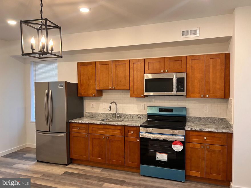 Welcome to 2035 W Toronto St, Philadelphia, PA 19132, a beautifully fully rehabbed and modernized duplex unit in the heart of Glenwood. This spacious three-bedroom, one-bathroom home has been meticulously renovated from top to bottom, offering a perfect blend of comfort, convenience, and style.
Step inside to discover an open and airy floor plan designed for effortless living. The brand-new kitchen is a standout feature, boasting sleek stainless steel appliances, elegant cabinetry, and modern finishes that make cooking and entertaining a delight. Each bedroom offers deep closets for ample storage, while ceiling fans provide additional cooling alongside the central air and heating system for year-round comfort. The unit has been fully renovated with high-end finishes and features three large bedrooms, a modern kitchen, and an in-unit washer and dryer for added convenience. Located on a quiet block with neighboring homeowners, this first-floor, entry-level unit offers a peaceful and welcoming community. Section 8 voucher holders are welcome. This stunning unit will not last long! Schedule your tour today and make 2035 W. Toronto Street #2 your new home!