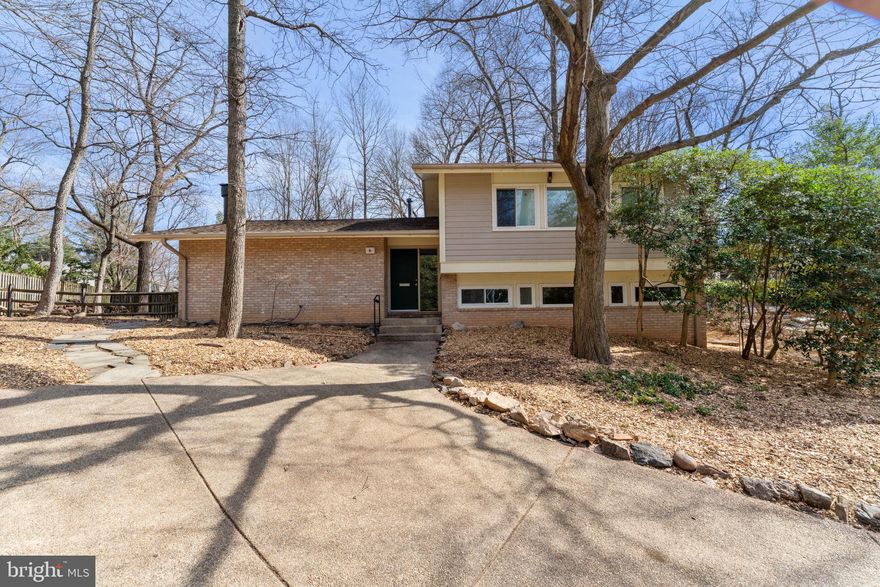 OPEN HOUSES CANCELLED - Seller received unsolicited offers. Seller has the right to accept any unsolicited offer prior to deadline. Welcome to 6 Lakeside Overlook, a charming mid-century modern home nestled on a quiet cul-de-sac within Rockville’s highly sought-after New Mark Commons community. Designed by the award-winning firm Keyes, Lethbridge & Condon and developed by Edmund J. Bennett, the neighborhood was listed in the National Register of Historic Places in 2017. 

The rarely available and fully renovated residence features 4 bedrooms and 3 bathrooms, offering spacious living areas with striking architectural details throughout the split-level floor plan.

The expansive main level includes a bright living room and dining room with vaulted ceilings and a cozy fireplace. The newly renovated eat-in kitchen is a chef’s dream, complete with stainless steel appliances. Just outside, a large patio overlooks a lush, fully landscaped, and fenced-in yard—perfect for relaxing or entertaining.

Upstairs, the generous primary bedroom offers double closets and an updated en-suite bathroom with a walk-in shower. Two additional well-sized bedrooms share a completely remodeled hall bathroom with a tub.

Downstairs is a cozy, light-filled den with custom bookshelves, an additional bedroom and bathroom, and a separate laundry room. Finally, on the lower-level is a recreation room and a spacious storage/workshop area—ideal for hobbies or extra storage.

New Mark Commons offers a variety of fantastic amenities, including a scenic lake, swimming pool, tennis and basketball courts, clubhouse, bike paths and a tot lot. If that isn’t enough, the prime location will be – one block from the RideOn bus to the Rockville Metro and only 0.5 miles from Rockville Town Center and Exit 5 off I-270. This is one you do not want to miss!