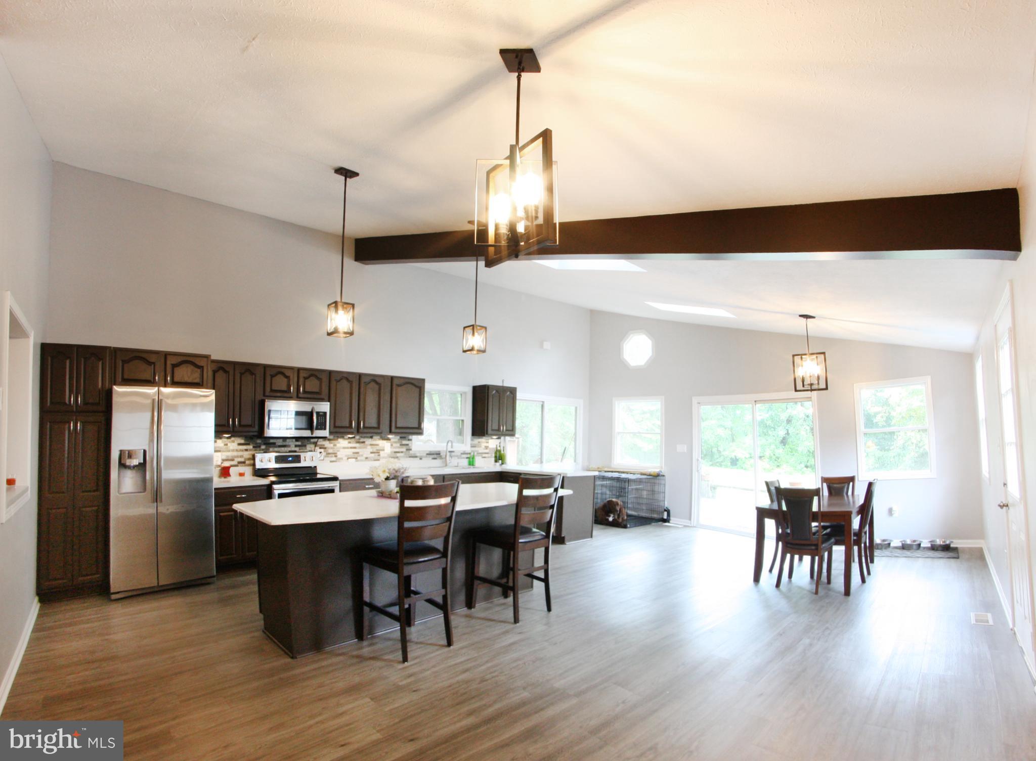 Gorgeous completely remodel home on quite street. This 3 bedroom 2 bath home has all new flooring throughout. Both bathrooms have been remodeled. New roof (April, 2018), seamless gutters, and all new water and sewer lines. House has a large open floor plan with remodeled kitchen which looks out on to the large fully fenced in backyard