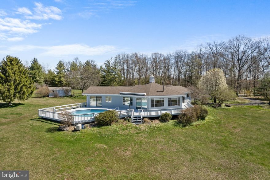 Welcome to “Hidden View Farm” at 1180 Salford St, tucked away on 20 acres of natural beauty, this contemporary style home offers the perfect blend of privacy, space, and opportunity. This unique property is ideal for buyers seeking a peaceful retreat with room to customize and create their dream home. The home features 1,894 sq ft with 3 Bedrooms, 2 Bathrooms, a 2-car Garage and a fantastic great room with panoramic views. Boasting clean architectural lines and an open-concept layout, the home is flooded with natural light. Inside, you'll find a hexagonal exposed beam ceiling, with multiple windows and glass sliders to view the attached pool. There’s a flexible floor plan that invites creativity and modern upgrades. This move-in ready home offers endless possibilities, including the potential to subdivide the 20 acres. There’s ample space for gardening, recreation, or future outbuildings, horses, livestock and growing crops. Whether you're envisioning a stylish modern renovation, a sustainable homestead, or a private weekend getaway, this property offers a rare chance to craft something truly special. Enjoy daily sunsets over the land and watching skiers from a distance in the winter on Spring Mountain. Bring your vision and make this one-of-a-kind property your own. A rare offering that combines location, land, and opportunity. Conveniently located in Upper Salford Township in the desirable Souderton Area School District, close to Rt 29, Rt 113, Rt 63, and easy access to the PA Turnpike at Lansdale.