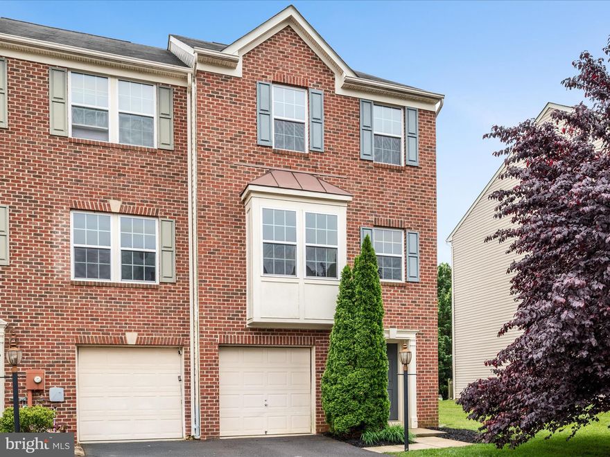 Rare price for a great townhome in Windmill Crossing! Get a deal on an end unit backing to trees with a multitude of superb features. Starting outside, the yard is fully fenced and includes a deck for optimal outdoor relaxation. Inside, there's a well-appointed kitchen with wood floors and tall cabinets, plus a rear bumput with a cozy, heat-producing electric fireplace. The primary suite upstairs includes a spacious walk-in closet and soaking tub in the ensuite bath. A one-car garage and unfinished bonus space with egress access on the entry level provide storage options and ample room to expand.  With 3 bedrooms and 2.5 baths in over 1700 square feet, you can't beat the location of this conveniently situated community right off Rt. 340 in historically hip Charles Town! Consider making this your new home or next investment opportunity!