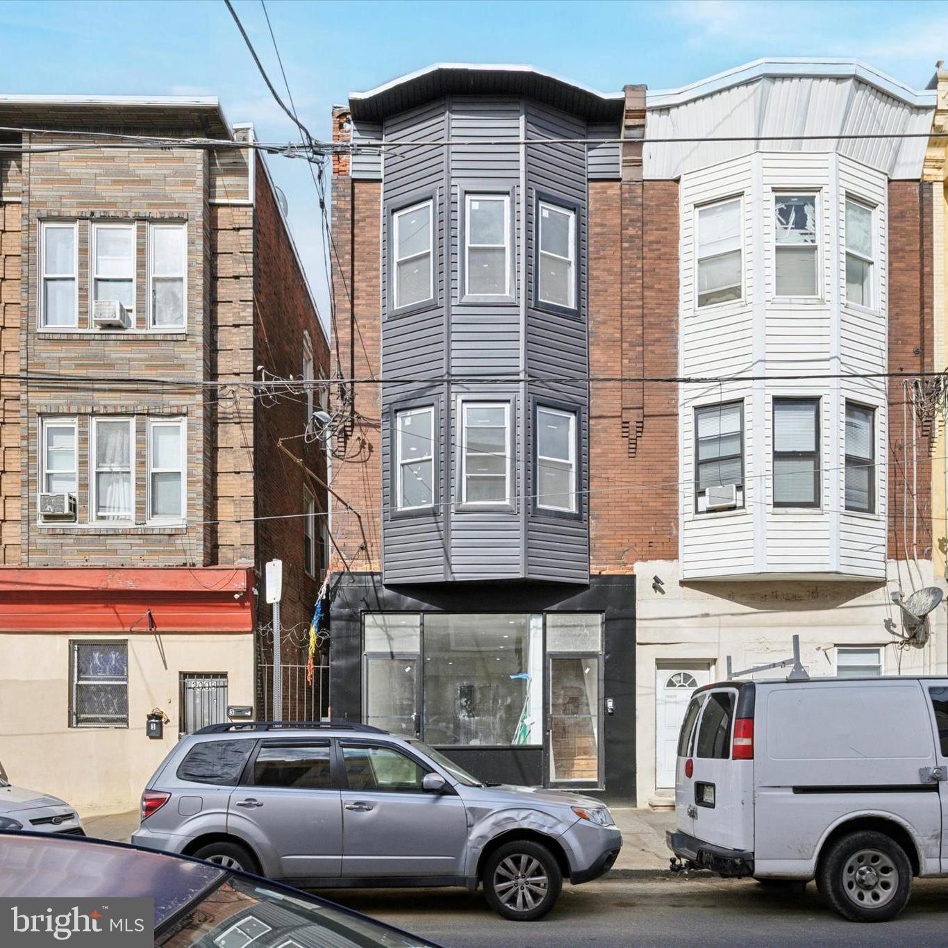 Welcome to 2006 S. 7th Street — a fully renovated mixed-use investment opportunity in a prime South Philadelphia location! The first floor features a white-box, rent-ready commercial space with two bathrooms and basement access for storage. This versatile space is ready to accommodate a variety of businesses such as an event venue, retail shop, office, studio, and more. Upstairs, you’ll find a beautifully renovated bi-level 4-bedroom, 3-bathroom apartment. The main level boasts a spacious, bright & airy living and dining area, new flooring, recessed lighting throughout, and a modern kitchen complete with quartz countertops, a tiled backsplash, overhang seating, and a full stainless steel appliance package. This level also includes a bedroom, laundry room, generous closet space, and a fully updated bathroom with new fixtures, vanity, and flooring. The upper level features three additional large bedrooms with ample closet space, a hallway closet, and two more fully rehabbed bathrooms with stylish new tile, flooring, vanities, and tubs. With its booming location near shopping, dining, and public transportation, this property offers tremendous rental income potential. Whether you’re an investor seeking a strong cash-flowing asset or an owner-user looking to combine business and living space, 2006 S. 7th Street is a rare opportunity you won’t want to miss.