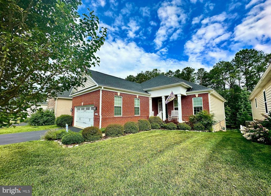 Gorgeous well maintained 3-4 bedroom 3 bath home in sought after Virginia Heritage! Walk onto the rocking chair front porch and into the spacious entry way boasting hardwood floors. To the right through double doors you may enter the office or 4th bedroom. To the left down the hall you will find the 2nd bedroom, full bath, laundry room, and access to the large 2 car garage with storage. Continue further and the home opens up to the spacious open concept living area that walks out to your private covered deck overlooking the woods. Here you will find the well appointed kitchen with stainless appliances, granite counter tops, gas range (that can be converted to electric), wall ovens and plenty of storage. A large island separates the kitchen from the dining and living areas, along with beautiful tray ceilings. What an enjoyable space to sit in front of the fireplace and look out to the trees out back. The primary bedroom, which also opens up onto the covered deck, offers 2 closets ( 1 of them being a walk in closet) and a spacious full bath with double vanity and an enormous walk in seated shower! The water closet is also very spacious! You will be amazed when you walk downstairs and find the enormous finished lower level that includes a family room area, a very large guest bedroom, full bath, and a huge storage room! This area walks out onto a brick patio that looks at the woods. The underground sprinkler system will help you take care of your lawn.  Your HOA covers FIOS Internet, cable and trash pick up twice weekly!  This beautiful  home has everything that you need!