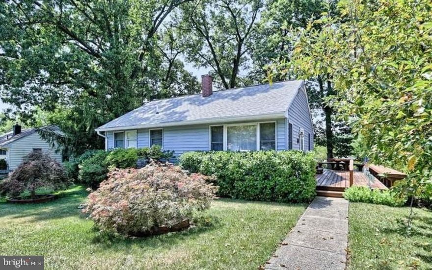 Located just off Rockville Pike, this is a great opportunity to own a well-maintained home on a wooded, fenced lot, complete with a hot tub and separate garage/workshop with ample upper level storage. This charming two bedroom rambler features a large, sunny family/living room with hardwood floors, two bedrooms, and one full bath. The kitchen includes a spiral staircase leading up to a carpeted loft w/ addt'l storage, suitable for a small office or work out or sitting room. The front of the home has two beautiful Japanese maples and an apple tree,  while the wraparound benched deck extends from the entrance  to the back door, overlooking the well-manicured backyard and hot tub! Long cement driveway can accommodate several vehicles. Located just 1.7 miles from the Rockville Metro station, minutes to bus stops, shopping, library, and schools- including award-winning Richard Montgomery High School. Seller to provide 1-Year Home Warranty.  Ready for immediate occupancy.  Hurry,  this one won’t last!
