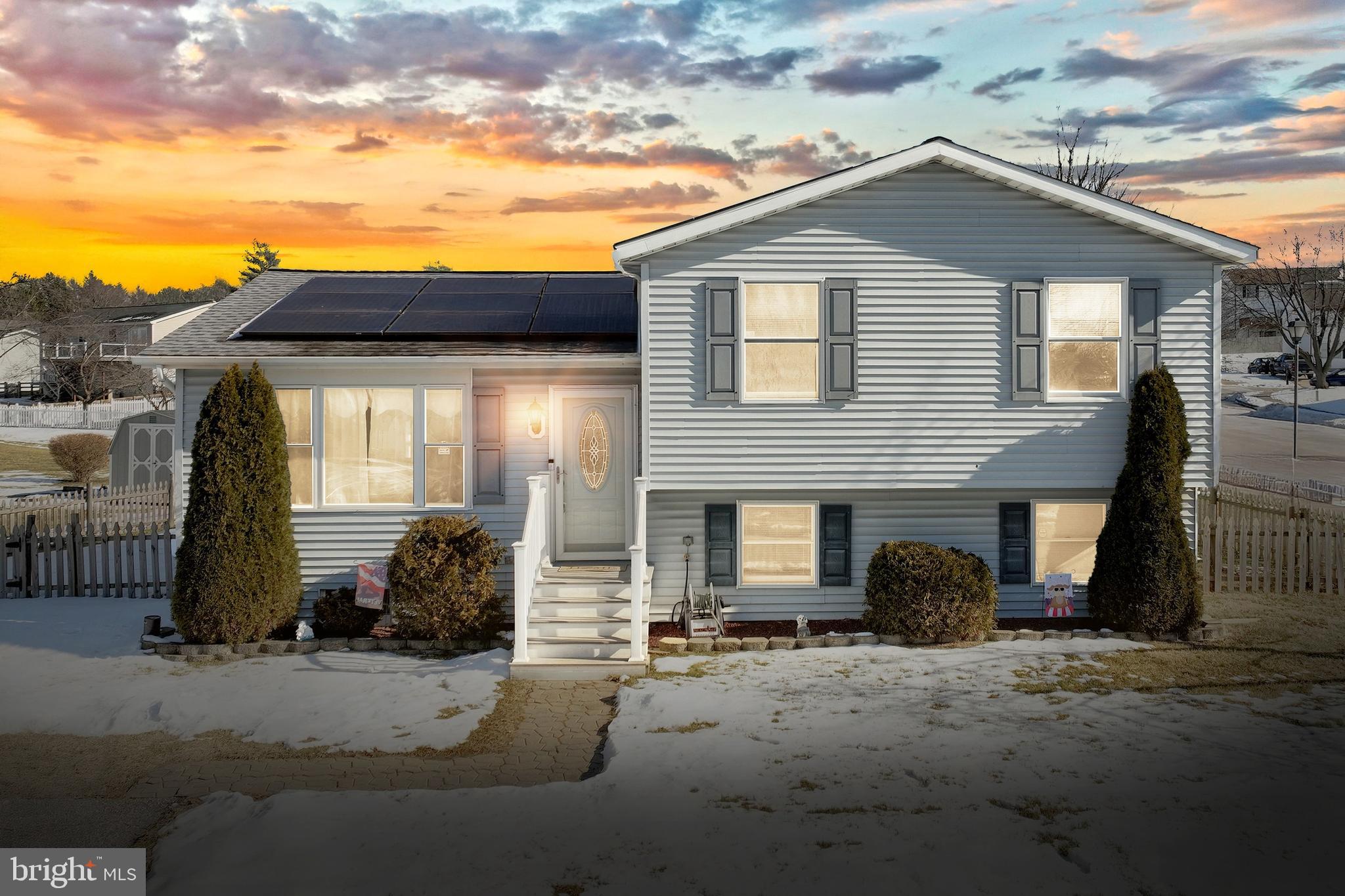 ** Reduced! Welcome Home to 401 Stacy Lee Court! This spacious and well-maintained split-level home sits on a desirable corner lot and offers a perfect blend of comfort and functionality. The main level features a bright and airy living room with vaulted ceilings, a generously sized kitchen and dining area, and direct access to a large two level deck, 16X20 top deck and 10X10 lower deck—perfect for entertaining. The fenced backyard includes a storage shed and a sprinkler system for easy maintenance. Upstairs, the primary bedroom boasts a private en-suite bath, while two additional bedrooms share a full hallway bathroom. The first lower level offers a large family room with walk-up access to the backyard and another full bath. The second lower level provides a versatile bonus room and a utility/laundry room. Energy-efficient solar panels and a five-year-old roof provide energy efficiency and cost savings, this home is as practical as it is inviting. Fresh paint throughout and recently updated bathrooms add to the appeal of this home. Less than a 10 minute walk to all of the summertime fun the newly remodeled Westminster City Pool has to offer! Don't miss this fantastic opportunity to own a home that combines space, convenience, and sustainability!