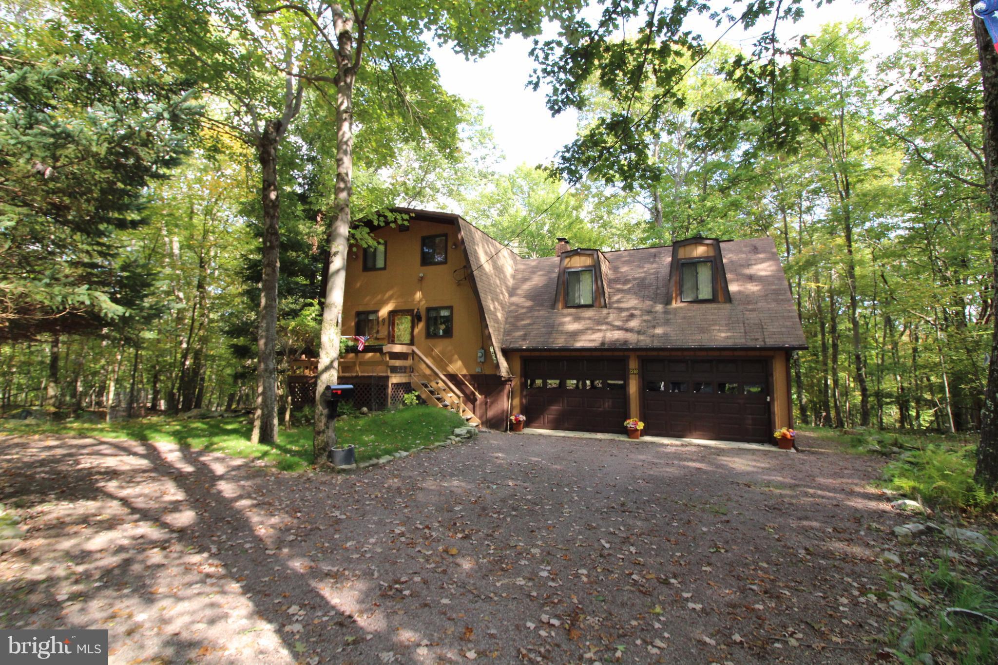 Price Reduction on this Chalet in Alpine Lake Resort! Well maintained 3 bd-2 bath home, updated carpet 1 year ago. Beautiful wooded setting, watch the deer & turkey graze while relaxing on the back deck. Great room has wood ceilings, wood-burning stove for those chilly evenings. Kitchen with a separate dining area. Spacious family room, Large parking area, circular driveway, 2 car attached garage. Home being Sold *As IS*.