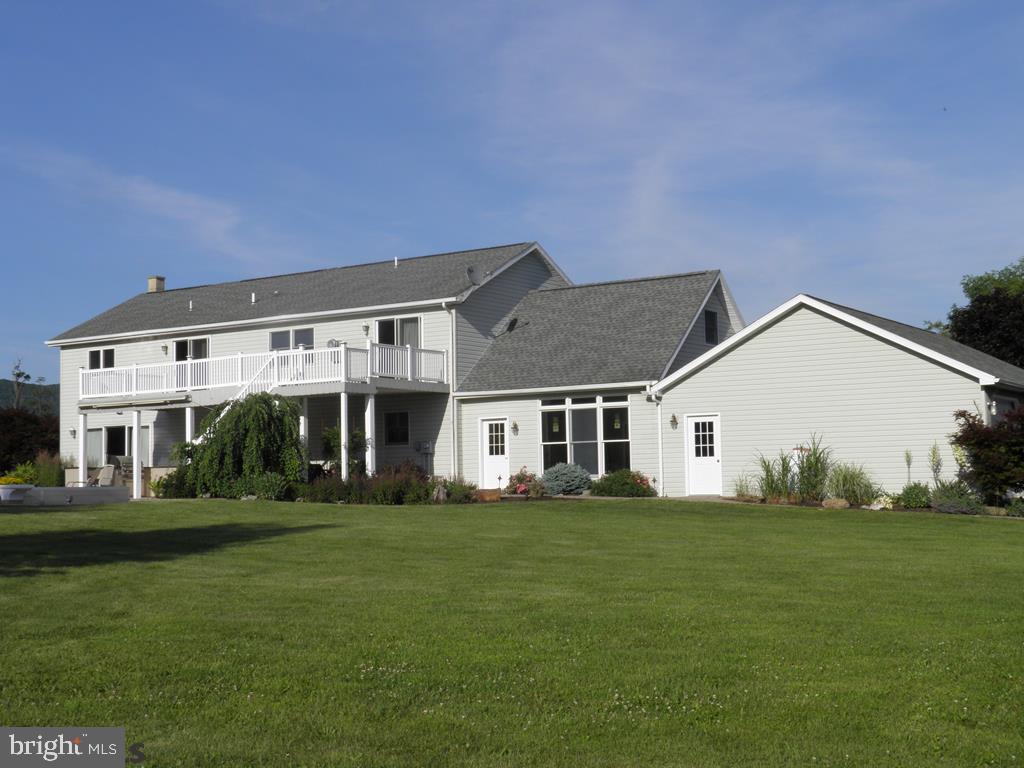 Pristine, Exquisite Country Estate! Stunning 3 bedroom, 2 bath home features chefs kitchen to die for! It has a bar/island that seats 6, real wood, soft close cabinets & views of the fields & yard! Amazing lighting throughout home adds warmth to all areas. A loft doubles as an office or library, pantry with bar & wine fridges, tile floors, fireplace in living room and master bedroom and so much more. Double doors in the loft, game area and master bedroom leading out to second floor deck. Exterior has in ground heated pool, professionally landscaped yard, lighting, three car attached, and three car detached garage, open level land with views of mountains and farm fields. Property conveys w/apx 3 acres & is subject to subdivision. Must see pics.
