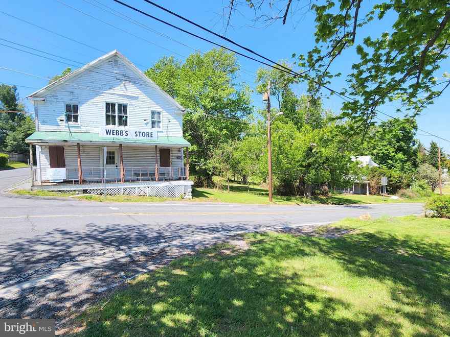 This sale includes two primary structures plus a detached garage on a 1-acre lot. Webb’s Store (ca.1897), formerly A&W Grocery, served the community for over 80 years and a Victorian home (ca.1899) located next door on the shared parcel. The property is situated at a four-way stop along a heavily utilized country road that offers plenty of public exposure for your business. Zoning is R-200/NR – Neighborhood Retail overlay allowing for a variety of potential residential and/or commercial uses. The corner store building is approximately 2,750 SFT and consists of a main floor with traditional general store floorplan and includes a restroom and large storage room. The upper level offers a large open space with high ceilings and additional restroom. Located just north along Clarksburg Rd, the included Victorian home is approximately 1,680 SFT and offers 3-bedroom 2 full baths. The metal roof on the home appears to have been replaced in 2008. Shared septic and well. Both structures will require extensive renovation and are being sold strictly as-is. The property is located within the Lewisdale Historic District but is not on the Historic Register. Potential buyers are encouraged to conduct their own due diligence for condition and acceptable use.
