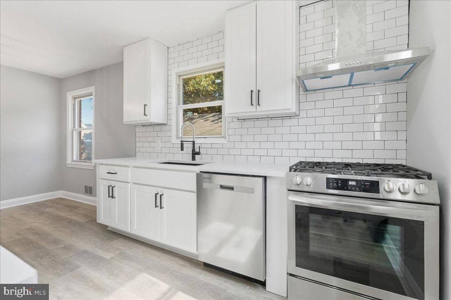 Welcome home to this beautifully updated 2-level solid brick rambler. Step inside to discover a bright, open layout featuring all-new flooring, custom designer paint, and elegant lighting throughout. The chef-inspired kitchen boasts brand-new cabinetry, gleaming quartz countertops, stainless steel appliances, and a stylish tile backsplash. Both bathrooms have been tastefully updated with contemporary finishes. Enjoy cozy evenings by the fireplace or entertain in the fenced backyard, perfect for gatherings or peaceful relaxation. A detached garage adds extra convenience and storage. This is the one you've been waiting for!