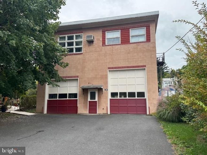 Home & Business Opportunity!
Formerly Breon's Garage, this is a 2 story, well constructed,  block building with 1st floor garage/shop and second floor apartment/living quarters. The garage level has 2 large overhead doors on the front and 1 on the rear. The garage has a hoist, shelving, half bath, storage rooms, etc. Tools and equipment are negotiable. 
The second level is a 3-4 bedroom home/apartment with large eat-in kitchen, dining area, huge living room and full bath. There is even a small covered rear porch for added living area. All appliances are included so this unit is move-in ready. A single oil boiler in the garage area provides heat to both units.  Electric services are separate. The front parking lot easily holds 6+ cars, plus room for 2 more to the rear. 
So whether you want a commercial garage, room for your cars, motorcycles, ATV's, etc. or want to have another business, this might be the location for you. Come take a look. Village Commercial zoning allows for many uses.