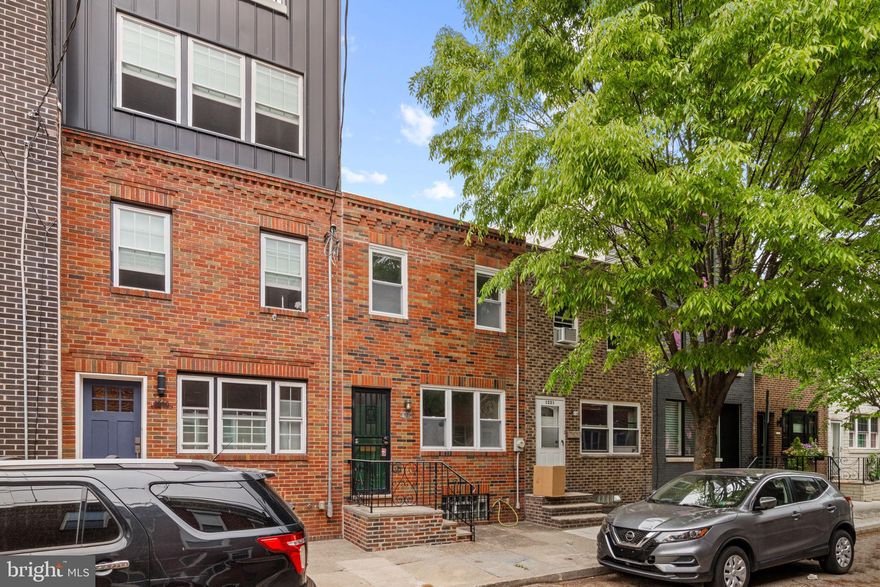 Stop and smell the roses!  This Passyunk Square gem has the nicest garden you’ll find in South Philly!  Its flowering vines, rose bushes, blooming buds, and lush greenery will entice you outside to your private oasis all spring and summer long.  Inside, the first floor has a tiled vestibule entry and ample space to configure your living and dining spaces as you see fit, perhaps even adding a reading nook, play corner, or additional sitting area.  The kitchen has shaker cabinets, quartz countertops, gray subway backsplash, and under cabinet lighting.  You’ll enjoy natural light coming in from both the rear door and the oversized window at the sink - and you’ll love the garden view you’ll have while doing dishes!  Upstairs are three generously sized bedrooms and a white tiled bathroom with tub and medicine cabinet storage.  The hardwood floors have just been refinished throughout, and the home has been freshly repainted as well.  The location of this home can’t be beat - just one block from Columbus Sq Park and Burrata Restaurant, two blocks to Mighty Bread, The Tasty, and ReAnimator Coffee, 3 blocks to Green Eggs Cafe, within ½ mi of most East Passyunk shops and restaurants, and located within Coppin Catchment!  The street itself is not a commuter street, and homes on this block benefit from extra long lot sizes (this one is 75’ long!) making the homes feel spacious.  Find your new home at 1223 Latona St!