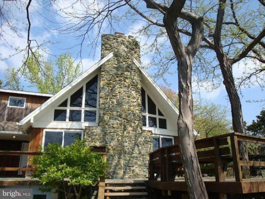 Beautiful 3 Bedroom 2 Bathroom WATERFRONT home. floor to ceiling glass doors and walls with full waterfront view. gorgeous stone fireplace and wrap a round deck. Beautiful landscaping with 190-foot pier.