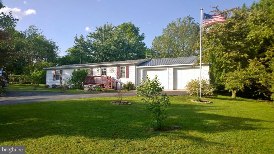 MFG. HOME WILL NOT QUALIFY FOR USDA LOAN PROGRAM  Move in ready with new roof. Large private yard has mature trees, large shed, rear deck and lovely water garden for relaxation. This home is a great value. Lovely manufactured home on permanent foundation, crawlspace, and two car att garage. All newer lawn maint equipment conveys.  Spring Mills school district.  One-year home warranty coverage.