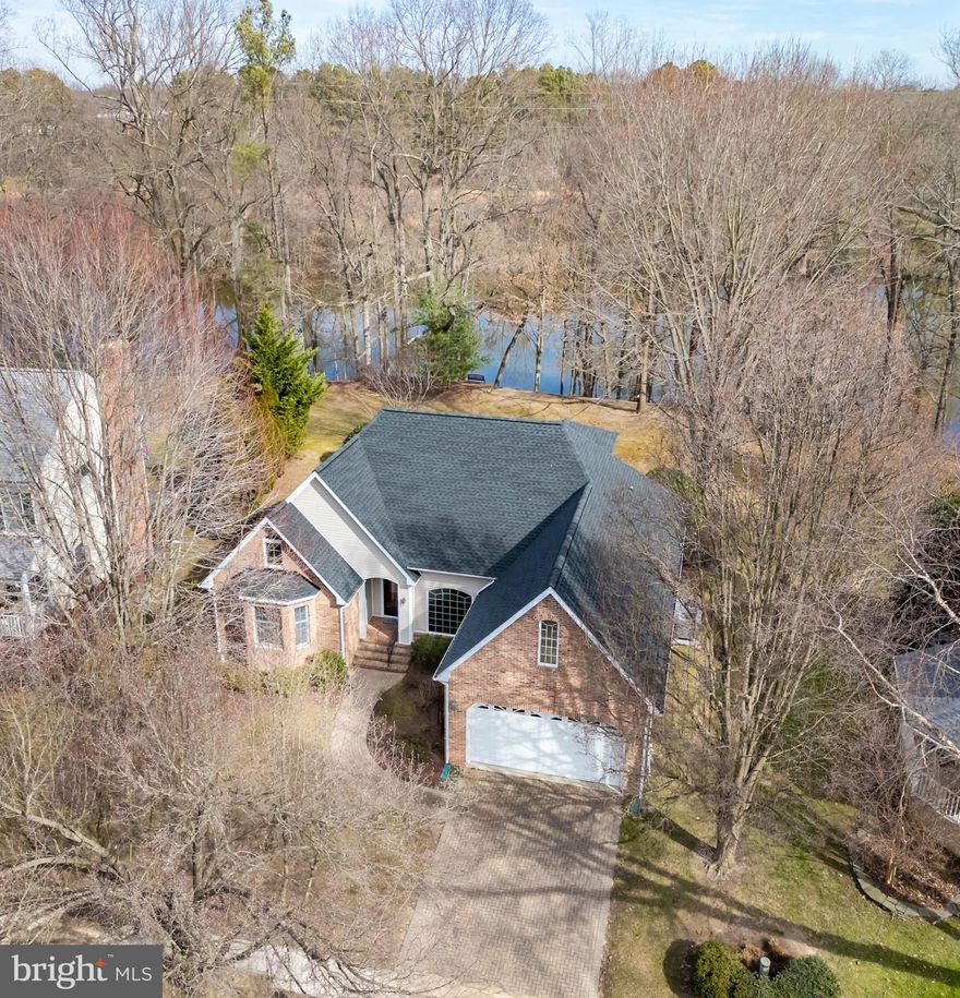 Waterfront Serenity! This fabulous home nestled on  a high bank boasts great waterview's of Papermill pond  in a peaceful park like setting. Great location close to town in a small  enclave in the desirable Oxford Road Corridor. Fabulous indoor and outdoor spaces perfect for relaxing or entertaining!  Featuring an open floor plan  exuding  warmth and welcome, and many  upgrades.  The inviting  living room  with 9' ceilings and wood floors  integrates perfectly with the formal dining room, kitchen & sunroom.  Spacious kitchen has a bar, granite counters, stainless appliances and bright breakfast nook. Sunroom showcases the serene waterviews with walls of class which leads to a  sizable deck and patio. Large  first floor  ensuite primary with primary bath boasting  dual vanities, soaking tub, separate shower and  walk in closet. Generous additional first floor bedrooms are connected by a Jack & Jill bath and located on other side of the house from the primary. First floor amenities includes pantry and laundry room.  Second floor features additional bedroom/office and 32 x 14 bonus room ideal for play room, studio or workshop.- many possibilities. Additionally the  walk in attic provides ample storage!  Attached 2 car garage and driveway provide good parking. Outdoors the picturesque yard  has wonderful  mature landscaping enhancing the privacy and tranquility of the property. Recent improvements include new roof, 2nd floor HVAC and hot water heater. Come and experience for yourself!