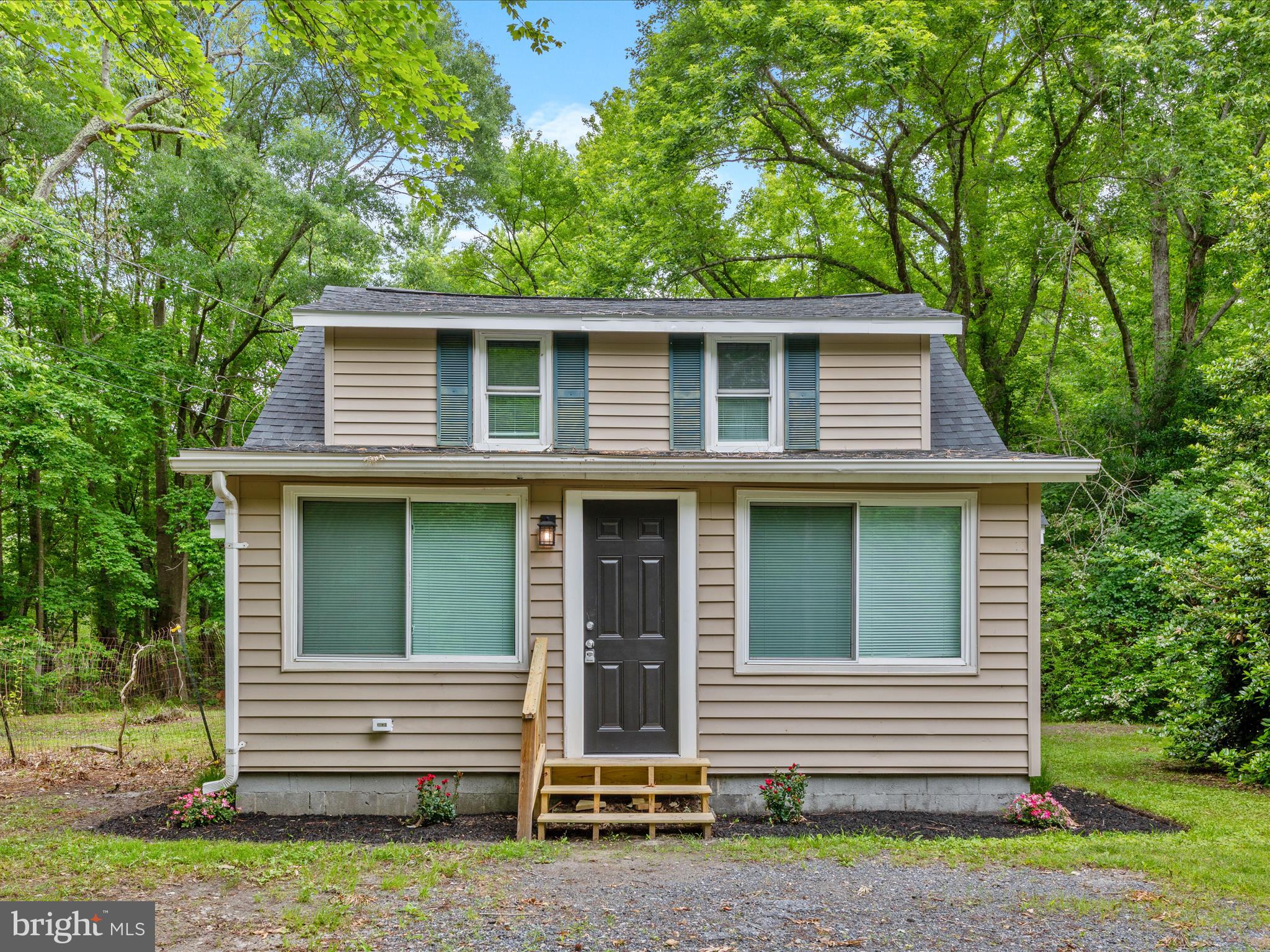 Listed below the appraised value. This is your opportunity to have instant equity! Completely renovated and move-in ready, this charming 3-bedroom, 1-bath home at 25308 Nanticoke Rd offers peaceful living on a private, wooded lot just minutes from downtown Salisbury. Inside, the home features a bright and open layout with brand-new luxury vinyl plank flooring, fresh neutral paint, and updated lighting throughout. The spacious living area flows seamlessly into a newly remodeled kitchen equipped with crisp white shaker cabinetry, modern countertops, and a brand-new appliance package.
The bathroom has been beautifully updated with elegant marble-style tile, a soaking tub, and modern fixtures. Upstairs, all three bedrooms provide plenty of natural light and tranquil views of the surrounding woods. Additional improvements include a new mini-split HVAC system for energy-efficient comfort year-round, updated plumbing and electrical, and fresh landscaping that enhances the home’s curb appeal.
This turnkey property offers a perfect blend of modern updates and serene surroundings. Schedule your private showing today!!