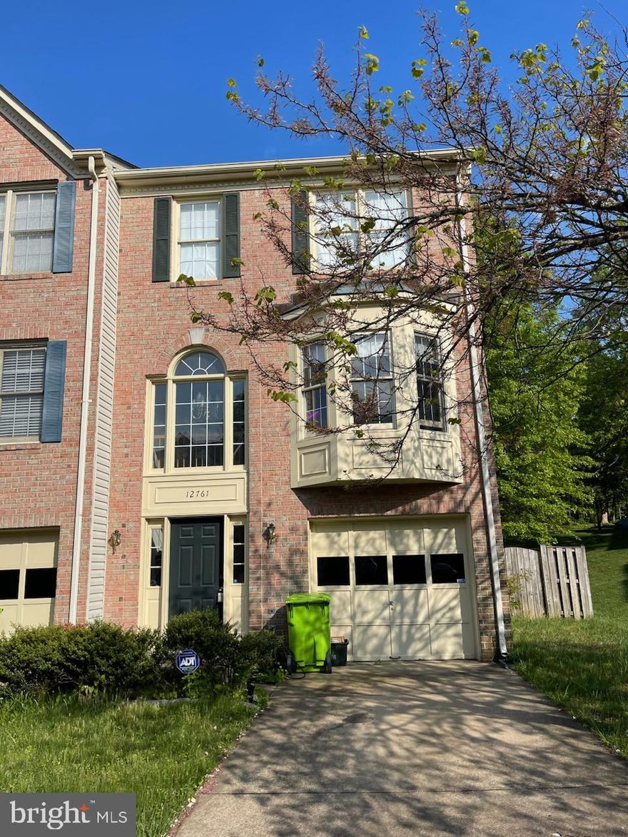 Nice three level end unit townhome with lots of light. Spacious home with two bay windows, hard wood floor through main level. Three full baths. Large Primary Bath. Single Car Garage. Large deck off kitchen. Walk out basement. Just across from the library and park.