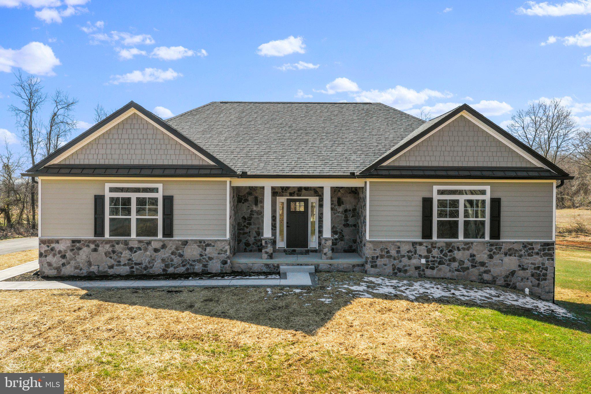 Brand new CUSTOM BUILT home on over 2 acres! Construction is complete and ready for a new buyer. This house is full of luxury finishes. The kitchen has been upgraded with recessed lights, granite counters, stainless steel appliances and custom cabinets. The great room is a nice large open space connecting to the kitchen for ease of entertaining. The great room welcomes you with cathedral ceilings , gorgeous hardwood floors , a stone fireplace and views to the rear farmland and stunning sunsets. The primary bedroom has a tray ceiling, a full private bath with a deep soak tub and separate tiled shower and two individual closets. Bedroom 2 and 3 are divided by a full bath and are positioned on the opposite side of the house for privacy. The main level laundry room offers convenience.
The lower level has been partially finished with a flex room, 4th bedroom and a full bath. Walk right out to the amazing yard from the basement. Play some catch, build a playset or grow the most amazing garden.
The other 3/4 of the basement is unfinished and is awaiting your dreams and desires. Hardiplank siding wraps the house with a taste of elegance and warmth while the stone front foundation and extra transom windows give this home the custom feel of perfection.