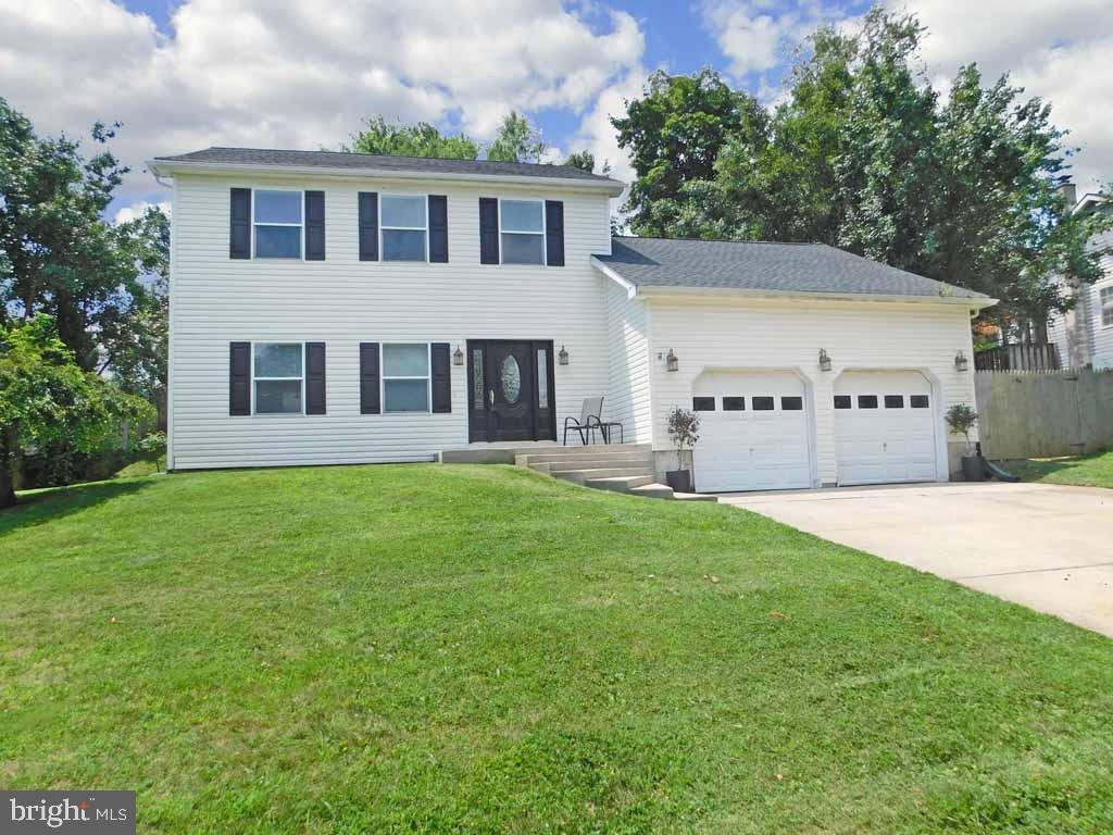 Open Sunday 1-3pm.  FRESH UPDATED LOOK! Nestled in the heart of the Bucks County Estates neighborhood, this home has great curb appeal.  Enter through the  foyer and you are welcomed by the gleaming hardwood floors.  The floors flow completely through the large living room, the formal dining room, kitchen and family room.  This home has been perfectly prepped inside with the kitchen featuring granite counters, glass backsplash, stainless steel appliances and loads of counter space.  There is an entrance to the rear patio off the kitchen sliders.  The family room features soaring ceilings and has an entertainment bar incorporated with the kitchen. An additional rear entry to the yard through french doors from the family room.    Upstairs you will find 3 large bedrooms.   The master bedroom has 2 closets with organizers.   The master bath is all NEW!  Completely renovated and now features double sinks, a walk in tiled shower, and a linen closet.  Bedroom #2 has laminate floors and a large closet area, Bedroom #3 has a built in lofted bed area which can hold a full sized bed.  The rear yard has been terraced to maximize its use.   Extensive hardscaping through the rear.  Make an appointment now so you can see YOUR new home!