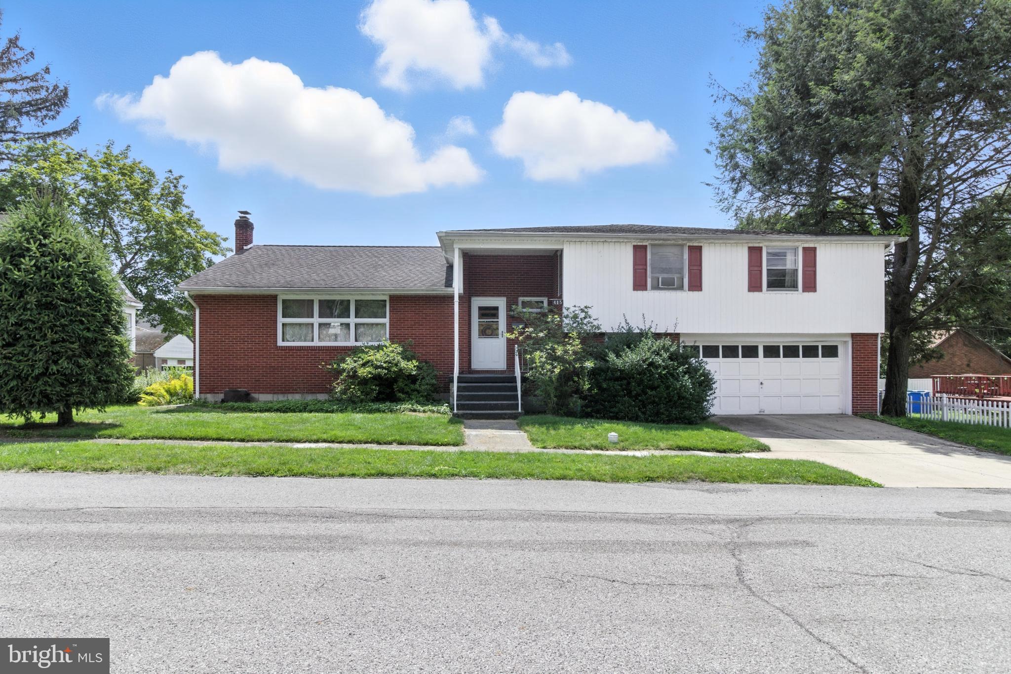 This beautifully maintained 4-bedroom, 2.5-bath brick home offers more than meets the eye—including a bonus potentially 5th bedroom in the finished basement, perfect for guests, a home office, or versatile living space. Situated on nearly 1/3 of an acre, the property boasts 2,380 square feet of warm, hardwood-filled elegance and comfort throughout. The formal living and dining rooms provide inviting spaces for entertaining, while a sunlit breakfast room adjoins a kitchen equipped with abundant cabinet space to inspire daily cooking. The cozy family room features a wood-burning fireplace for relaxing evenings. Upstairs you'll find four generously sized bedrooms, complemented by two full baths and a convenient half bath on the main level. A newer hot water boiler ensures reliable and efficient heating. Outside, the backyard transforms into a private retreat with an in-ground pool, open lawn, and mature landscaping—ideal for summer fun or peaceful outdoor lounging. An attached 2-car garage adds ease and convenience, rounding out the appeal of this thoughtfully designed home.