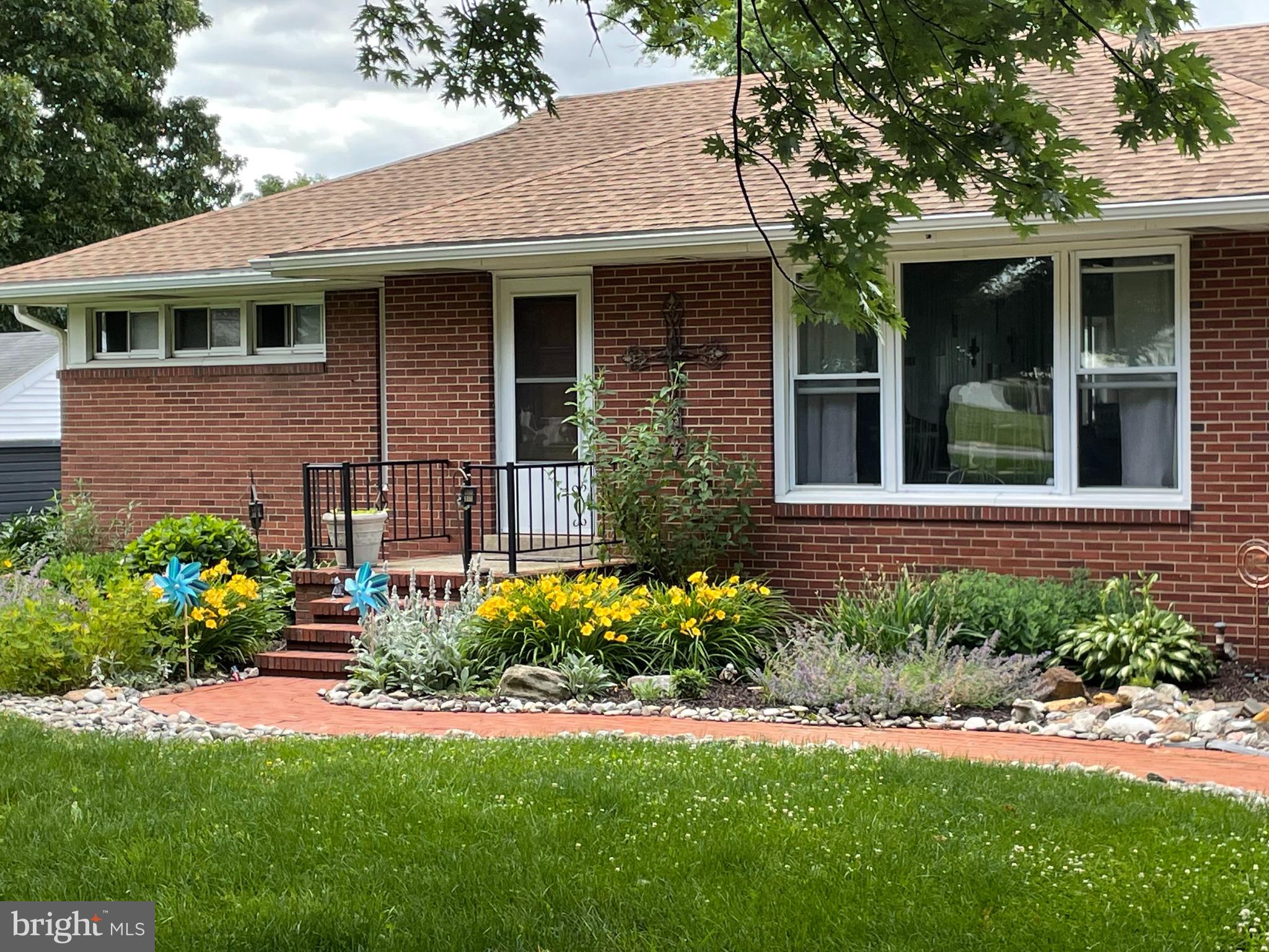 Large classic brick ranch with 3 bedrooms, 2 baths in the highly sought after Downingtown School District! A spacious floor plan greets you as you walk into the home with new flooring. The great room features a wood burning brick fireplace with large windows letting in natural light. Seamlessly transition to the dining room, which is adjacent to the sizeable sunroom/porch. Exit to an entertainers delight to a sun deck OR the custom brick patio with stone outdoor fireplace overlooking amazing panoramic views of the back yard and beyond. The primary living area has 3 bedrooms and a full bath and kitchen. The large, spacious walkout basement provides plenty of room to grow. Seller had planned to further renovate and is leaving the plans for the next owners. The attached 2 plus car garage is enviable as is the .70 acre lot with views of conservation land, never to be built upon. This home is equipped with solar power that translates into utility savings! New Roof, gutters and downspouts 2024! A must see. Minutes to all major roadways, train stations and shopping. COMING 3/21.