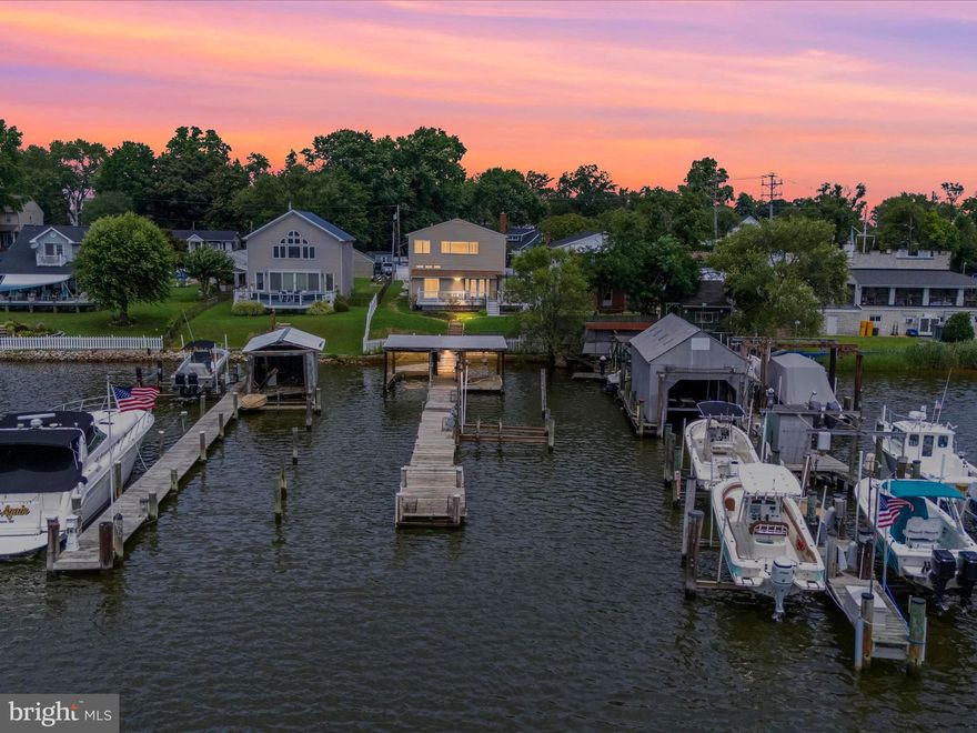 Waterfront home with in-ground pool! Long covered pier.  Private deep water pier with boat lift. Open floor plan, spacious kitchen, waterfront views, and gorgeous sunsets. Large deck overlooking pool, superior landscaping.  The main house has 3 bedrooms, 2.5 bathrooms, and a pellet stove fireplace. The pool house features 1 bedroom and 1 full bathroom(or in-law suite).  *Public water and sewer!*  (424 & 1/2 Greenland Beach Rd)