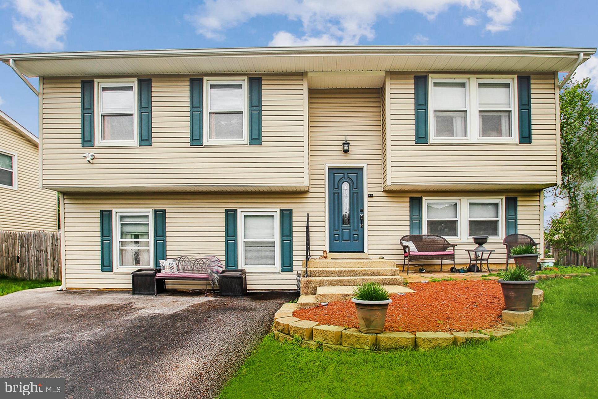 A UNIQUE OPPORTUNITY FOR TODAY'S COMBINED LIVING! Meticulously maintained 3BR/2.5BA SPLIT LEVEL boasting a completely self-sufficient LOWER LEVEL 2BR/1.5BA APARTMENT with private entrance! The main/upper level flows freely with Living & Dining Rooms, Kitchen, 3BR, 1BA, and Primary Bedroom Suite with walk-in closet & private Bath. Stairs descend to the lower level offering Rec Room, Office/Den, Half Bath, & Laundry. IMAGINE THE POSSIBILITES of a SEPARATE LOWER LEVEL APARTMENT with its own private entrance and main house access! The apartment features Living/Dining Room, Kitchen, 2BR/1.5BA, and its own Laundry! The home presents move-in decorator neutral paint palettes with hardwood, carpeted, & tile floors. Both living units share the lovely fenced rear yard with gazebo & storage shed. Multi-vehicle paved parking pad. Prime location near premier mall shopping, eclectic buffet of restaurants, diverse cultural venues, nature parks, golf, and major commuter RTs 97/301/50. A mere 30 mins. to Baltimore; 30 mins. to Annapolis; 40 mins. to D.C. EASY ACCESS TO ENDLESS METRO AMENITIES!!
