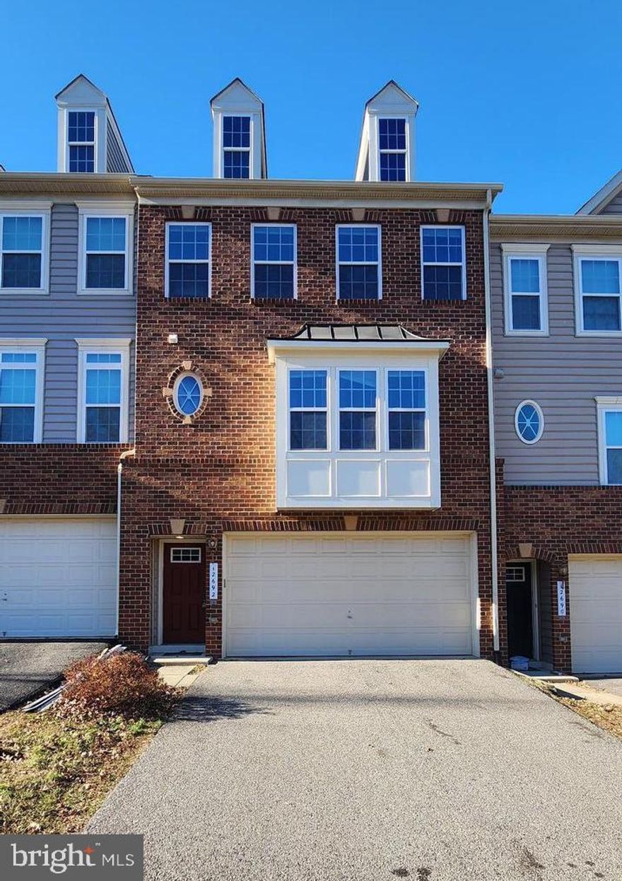 Contract fell through.... Beautiful/bright two car garage townhouse with bump out on 3 levels. Over 2800 sq feet, freshly painted with hardwood floors throughout the main level.  New carpet in the upper level and basement, Spacious kitchen with granite countertop, stainless steel appliances, brand new microwave, beautiful cabinets, island and lots of storage space. Trex deck, which is easy to maintain, Master suite with corner soaking tub and separate shower, finished walkout basement with rough in bathroom, sliding door to fenced rear backyard.  Close to shopping, government center, and Prince William Parkway.