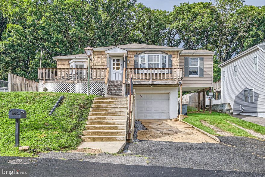 Move-in ready 3BR/2.5BA expanded Rancher located on a spacious lot in the growing and sought out area of the Baltimore Highlands section of Halethorpe. Pull into the driveway with a one-car garage tucked under the home, make your way to the front deck, and open the door into your forever home. The sprawling front deck wraps around creating tons of space to enjoy with family and friends. Step into a large living room boasting tons of natural light and a large opening into the dining room featuring a built-in corner hutch, wainscoting, and an elegant wall design.  Step through into the spacious eat-in kitchen offering plenty of cabinets including a double pantry cabinet, stainless steel appliances, plenty of counter space, and an island. Down the hallway are three bedrooms including a large primary bedroom featuring a half bath, two sizable secondary bedrooms, and a full bath. On the lower level is access to the garage, two rooms, and a full bath, laundry, and storage. The rooms in the basements are being used as a bedroom and a home office. Off the kitchen is a wood deck and a spacious three season room offering a hot tub and a view of the amazing yard space. The fenced yard features plenty of green space, a shed, and a deck with a pergola. This home has so much to offer new homeowners and is located within close proximity to shopping, restaurants, and commuter routes.