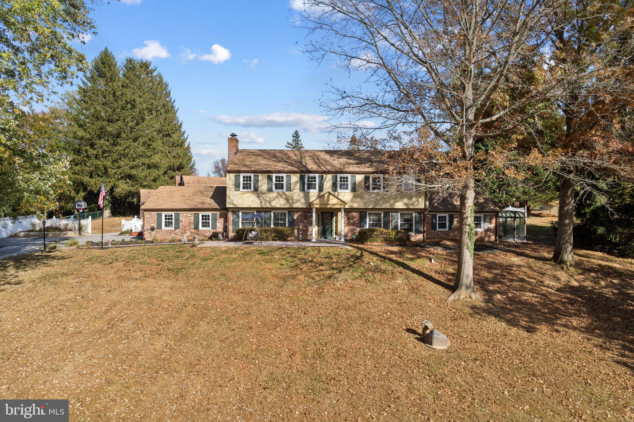 Nestled on a secluded 1.69-acre lot, on one of the most picturesque cul-de-sacs in Thornbury Township, this stunning Colonial-style home offers a rare blend of classic elegance and tranquil country living. As you drive down the peaceful tree-lined street, the beauty and privacy of the property immediately becomes apparent, making it the perfect retreat from the hustle and bustle of everyday life. The Main Level offers a thoughtfully designed layout including a welcoming foyer that opens into a formal living room with fireplace and adjacent formal dining room featuring custom millwork - perfect for hosting dinner parties or family gatherings. The large, sun-filled family room on this level is a true highlight, with expansive windows that overlook the beautiful backyard and pool. This inviting space also boasts a wood-burning fireplace and a convenient wet bar, ideal for entertaining guests or relaxing after a long day. For movie nights or quiet downtime, relax in the movie room or adjoining sun porch that provides a peaceful spot to enjoy a cup of coffee or take in the views. Also on this level is a private office, tucked away for quiet work or study. The eat-in kitchen offers plenty of space for both cooking and casual dining. The den provides a comfortable, relaxed space for gathering. A full bath on the first floor adds convenience and functionality. The Upper Level includes a spacious Primary Suite complete with a full bath, walk-in closet, and sitting area or exercise room. Three additional generously-sized bedrooms plus a full hall bath round out this level. The home’s outdoor living spaces are just as impressive as the interior. Step outside and enjoy your own personal oasis, complete with an in-ground pool and gazebo, perfect for summer lounging or hosting friends and family. The expansive backyard is an idyllic setting for outdoor activities, whether you're enjoying peaceful mornings on the patio or hosting a BBQ. A sizable detached barn/garage with loft and vehicle service pit adds an extra layer of versatility to the property. Whether you use it as a workshop, additional storage, or even as a studio, the possibilities are endless. Located in one of the most desirable areas of Thornbury Township, this home offers the perfect balance of seclusion and convenience. While tucked away in a peaceful cul-de-sac, it’s just minutes from local shops, dining, and major highways, providing easy access to all the best the area has to offer. This exceptional home offers comfort, style, and tranquility - the perfect place to call home!