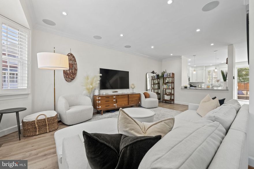 Look no further, this is the home for you! Immaculate and renovated from top to bottom. Simply, move your furniture and belongings in. Three level townhome with 1 car garage and 1 car assigned parking space (2 total spaces). Three bedrooms and three bathrooms (featuring new full bathroom on bottom level). Kitchen level and top bedroom level features Birch hardwood floors. Walk in level features bedroom and brand new bathroom. Bottom level bedroom or home office opens onto flagstone patio space. Main level has gourmet kitchen, large family room, dining room, and opens onto composite deck with privacy fencing. Top level has two bedrooms, two completely updates bathrooms, and laundry. Primary bedroom closet has Laren walk-in closet system installed. Primary en suite includes marble shower and glass doors, quartz counters, and Brizo fixtures. Enjoy all that Arlington and Washington, D.C. has to offer! Very convenient to commuter routes! Camera and audio may be on site. Additional visitor parking spaces available!