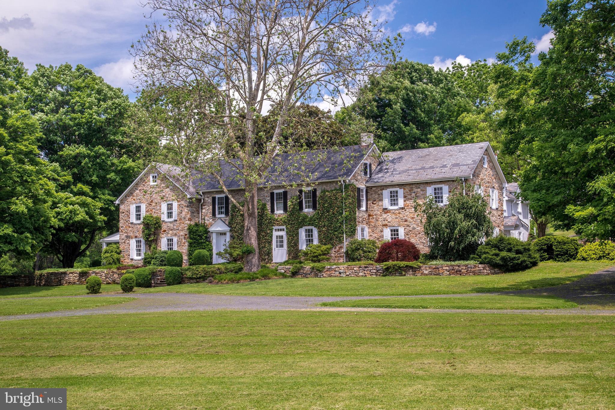 Majestic maples perfectly aligned frame the gated and private driveway leadingto an unforgettable country estate. A few miles from the Delaware River in therolling land of Upper Bucks County, Rolling Brook Farm includes a spectacular 72acres and is traversed by the pristine water of Cooks Creek, with its native browntrout. Cares drop away on the breathtaking approach, hinting at the incrediblyspecial place one has reached.Impeccably maintained and renovated through the years, each room in thecirca 1790 and expanded main house has been thoughtfully imagined andimplemented, blending history with modernity and creating timeless appeal.Rooms are richly appointed with open beams, stone walls, lustrous random widthpine floors, chair rail moldings and deep window sills, in a floor plan where nodetail has been overlooked for everyday comfort and gracious entertaining. Walk-in wood burning fireplaces with bluestone hearths are focal points in the formalliving and dining rooms. An inviting family room and handsomely appointedlibrary exude understated elegance with built in cabinetry and seating. Thesunroom with bluestone floor, beadboard ceiling and access to a covered patio isa tranquil spot to pause and begin your day.Bedrooms and guest suites are accessed from a traditional center stairway ororiginal pie stairs as well as a third stairway, and an elevator spans from basementlevel to the second floor. Sunlight streams into a stunning master bedroom suitewith dual walk in closets and two spa bathrooms. A luxurious guest suite awaitsovernight visitors and pampers with a charming fireplace, dressing area, stainedcherry floors and jacuzzi tub.Two garages with slate roofs and climate control preserve the integrity ofvaluable collections and equipment. A multi-level bank barn is also climatecontrolled, with a kitchen and indoor/outdoor kennels on the lower level. Theupper bank level offers 33 x52 of space, inviting a multitude of potential uses. Anoriginal carriage house provides extra storage for lawn and gardening gear.Breezes whisper across cultivated fields and grounds perfectly suited forcelebrations, grand or casual. The newly refinished swimming pool invites awelcoming interlude and boasts panoramic views of peaceful Pennsylvaniacountryside and memorable sunsets.A testament to historical integrity and an owner s enduring love, Rolling Brookstands ready for its next fortunate caretaker.