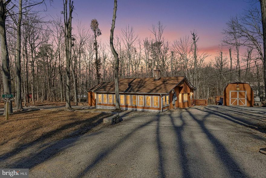 Looking to plant roots in a home that feels like a retreat, yet stays convenient to town? This single-level, 3-bedroom, 2-bath home offers over 1,656 square feet of finished living space, blending peaceful living with everyday practicality. Located in the desirable Shenandoah Retreat community of Bluemont, 558 Hemlock Lane has been thoughtfully cared for and recently refreshed with new paint and updated flooring in several rooms, along with updated kitchen appliances and improved exterior landscaping.

The home sits on 0.63 acres of wooded land, providing privacy, space, and a connection to nature. A whole-home backup generator offers peace of mind year-round, ensuring comfort even during power outages. Major systems have been proactively maintained and with the septic system recently pumped and inspected in October 2025, the next owner can enjoy peace of mind and avoid immediate out-of-pocket maintenance costs.

Whether you’re looking for a full-time residence or a weekend escape, this home delivers quiet mountain living without sacrificing proximity to local amenities.

The home is virtually staged.