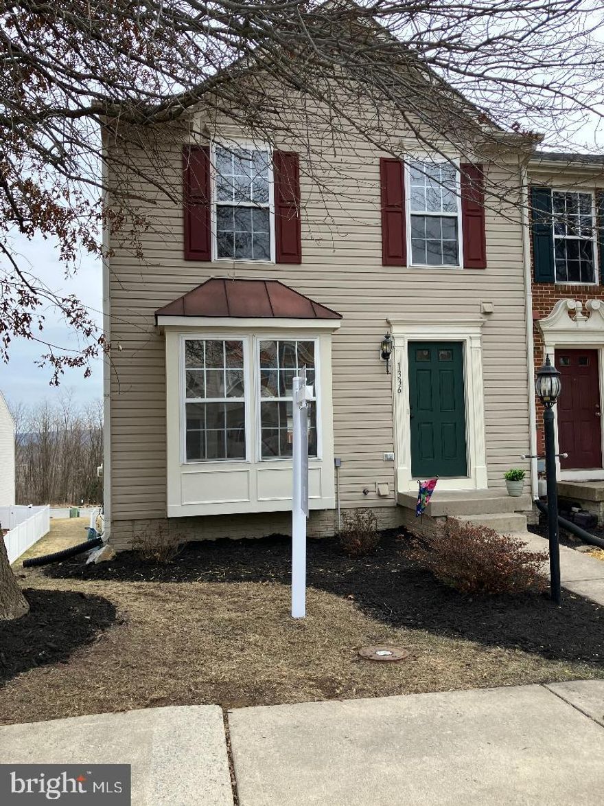 You'll love this spacious end-unit townhome located in the sought-after Fairfax Crossing Subdivision.  This bright townhome offers SO many extras!  As soon as you walk in the front door, you'll be greeted with beautiful hardwood floors throughout the main level.  The kitchen includes upgraded cabinets, a kitchen island, and a dining room that's perfect for family gatherings.  A large deck off of the kitchen offers mountain views, great for relaxing evenings with friends and family.  Upstairs you'll find 3 bedrooms, including a large primary bedroom featuring a walk-in closet and a private bath with a soaking tub and walk-in shower.  Go down to the lower level to a welcoming Rec room in the finished walk-out basement leading to a private fenced-in back yard with large concrete patio.   HVAC replaced in 2021.  New Carpet installed on the upper and lower levels.   Two reserved parking spaces directly in front of home.  This is a great neighborhood situated close to restaurants, shopping, and much more.  Schedule your showing today!