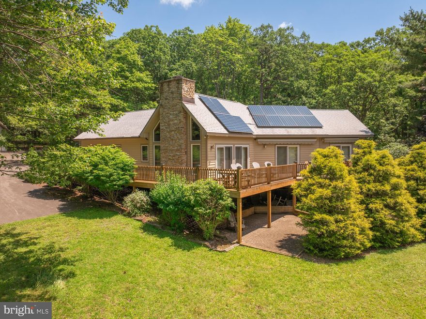 Discover the best of Deep Creek Lake living on a sprawling 276’ of waterfront in the highly sought after Turkey Neck loop. This contemporary home is situated nicely on 2.61 acres and is just steps from your private Type A dock. It feels very private from the moment you pull onto the paved driveway. Inside this thoughtfully designed single-level home you will find a spacious great room with vaulted ceilings, fireplace, and an open kitchen/dining/living area create a perfect gathering space. Boasting 4 bedrooms (two of which are en suites), 3 bathrooms, an open floorplan, hardwood floors and a main level laundry room. Step outside any of the multiple sliding doors to your expansive lakeside deck—ideal for sunsets, entertaining, or quiet summer mornings. Offering lake views from almost every room. The detached oversized garage is perfect for boat and toy storage. The buydown has been purchased, as well as a membership to the Loop Association which affords you access to 28.77 acres. Easy access to the Deep Creek Yacht Club. Call today to preview!