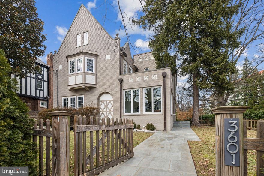 Welcome to 3601 Van Ness Street NW, a stunning detached Tudor home in wonderful North Cleveland Park.  Originally built in 1929, this grand home has been thoughtfully updated to blend classic charm with modern luxury.  Spanning approximately 4,600 square feet, the home offers 6 bedrooms and 4.5 baths across 4 levels of gracious living.

Pass the mature plantings and large front lawn to step inside an expanded first level, now featuring a spacious family room and a dedicated home office/bedroom—perfect for today’s lifestyle. No detail has been overlooked, with recent additions blending seamlessly into the original exterior architecture. The open-concept main level boasts high ceilings, gleaming hardwood floors with herringbone detail, restored lead glass windows, and gorgeous millwork. The gourmet kitchen is a chef's dream, complete with a striking walnut island with quartz counters, top-of-the-line stainless steel appliances, and pantry area.  An enormous dining room, a stately living room with an elegant fireplace, and powder room round out this level.

The second floor is home to a luxurious primary suite, complete with a spacious walk-in closet and a spa-inspired marble bath featuring a soaking tub and large shower. Two additional bedrooms share a generously sized bath.  The top floor offers a large fifth bedroom and full bath along with a versatile space ideal for work, playroom or hang-out.

The lower level is designed for entertainment, featuring a recreation room with a wet bar, a sizable sixth bedroom, and a full bath. A spacious laundry room with mudroom fittings and direct outdoor access are compelling features of this level.  Step outside to the enchanting yard, which includes extensive flagstone hardscaping, and convenient multi-car parking with an electric gate.  The house is fully surrounded by green hedging and evergreen trees.

3601 Van Ness is situated in a prime location moments from multiple local favorites such as Surfside, Cava, Saku Saku Flakerie, 2Amy’s, and Bread Furst (to name a few).  There are many neighborhood amenities nearby such as the Van Ness and Tenleytown Metros on the Red Line, convenient shopping at Target and Whole Foods, City Ridge with Wegmans, Tatte, Equinox, Taco Bamba and King St Oyster Bar, the bustling commercial area at Cathedral Commons, and excellent recreation at Hearst Park and Outdoor Pool, Friendship Library, Wilson Indoor Pool and nearby Rock Creek. The home is in close proximity to many public and independent schools.  Welcome home!