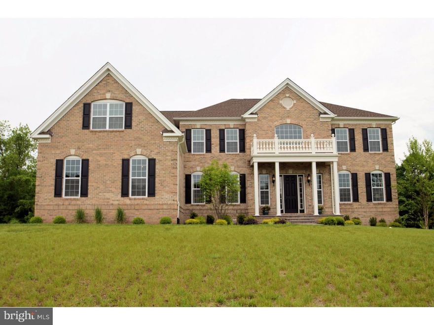 Located in Upper Makefield's most sought after and prestigious new construction community of Dutchess Farm Estates, this spectacular Toll Brother's Henley Georgian model sits perfectly on a premium cul-de-sac lot backing to woods. Barely 18 months old, this property provides an unparalleled opportunity for you to move right in, instead of waiting 10-12 months to build from scratch with the builder. The stately brick front elevation with Hardie Plank on all sides is a classic for-the-ages look. The Henley is Toll's most popular floor plan and features a spectacular foyer entry with butterfly staircase. Impressive 10' first floor ceilings,  detailed crown and box molding greet you upon entering, as well as beautiful dark hued scraped oak floors. To the right is a formal living room, to the left is the formal dining room, with tray ceiling, that is completely open to the breakfast room and kitchen. This customized floor plan is for maximum entertaining and large seating's for holiday gatherings. The gourmet's delight kitchen features white to-the-ceiling cabinets, giant center island, and extra-large walk in pantry. Appliances include 48" Sub Zero French Door Refrigerator, Wolf Double Oven, Wolf 6 Burner with Gridle Range, Wolf built into-the-island Microwave Oven and Kitchen Aid Dishwasher. Caeserstone counters, marble backsplash, farmhouse sink and triple sink window make this the most spectacular kitchen on the market. All of this is coupled with a huge breakfast room and triple French Door access to the Trex deck overlooking the rear yard and woods. The two story family room features a floor to ceiling stone fireplace with gas log burner. The bonus Palm Beach sunroom off the family room offers gorgeous views, dry bar with wine cooler and French Door entry. A formal office/library, giant mud room, powder room, and 3 car garage completes the main level. The upper level features three bright and airy bedrooms all with private baths, and luxurious Master Suite consisting of a large sitting room, main area with coffered ceiling, incredible Master Bath with oversized Carrera marble shower and flooring throughout, Victoria and Albert clawfoot tub, large walk in closets and exercise retreat. Second floor laundry room makes for super convenience. The lower level features an open oak tread staircase entry from the family room. Featuring walk-out access & rough-in plumbing, it awaits your personal design and finishing touch. Whatever you can imagine you can create!