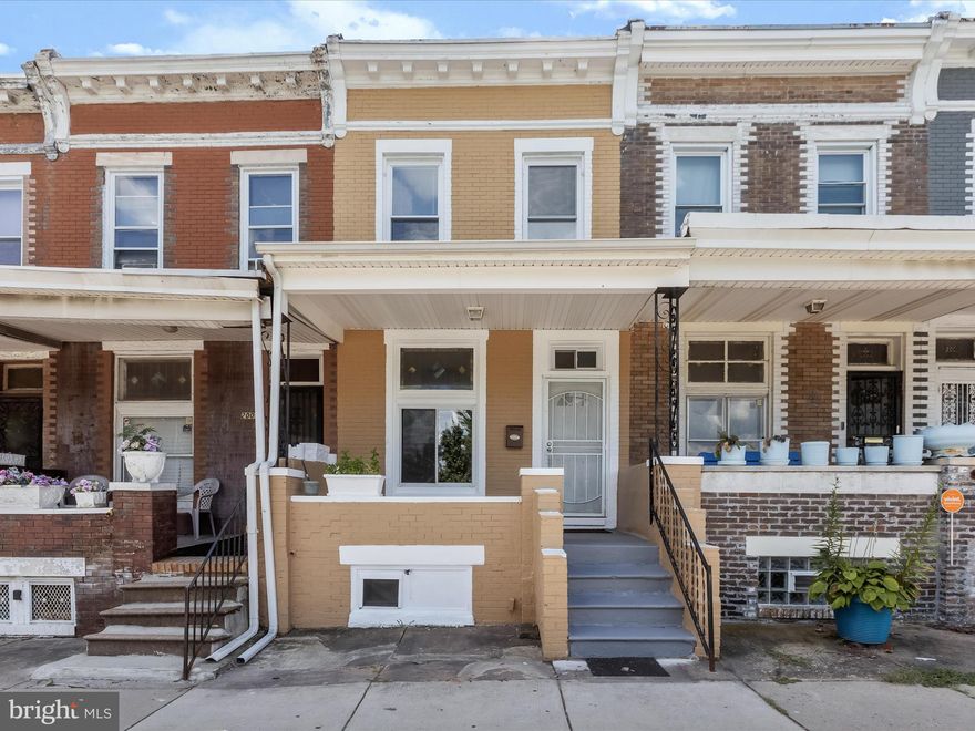 Welcome to the Clifton Park community of Baltimore City! This beautifully renovated rowhome offers modern comfort and historic charm just moments from Clifton Park and downtown Baltimore. A spacious front porch invites you inside to an open-concept main level featuring a neutral color palette, transom and stained-glass accents, and luxury laminate flooring that flows seamlessly throughout. The living and dining areas open to a stylish kitchen complete with sleek appliances, a decorative backsplash, ample cabinetry, luxury vinyl plank flooring, and walk-out access to the rear deck, storage shed, and fenced yard.  Upstairs, retreat to the light-filled primary bedroom with soaring ceilings and gleaming hardwood floors. Two additional bedrooms, including one with a skylight, and a renovated hall bath complete the upper level. The fully finished lower level expands the living space with ceramic tile flooring, a powder room, laundry, and the flexibility for an office, recreation room, or guest bedroom.  Perfectly located near major commuter routes, including US-40, I-83, and I-95, this home offers both convenience and comfort for city living at its best!