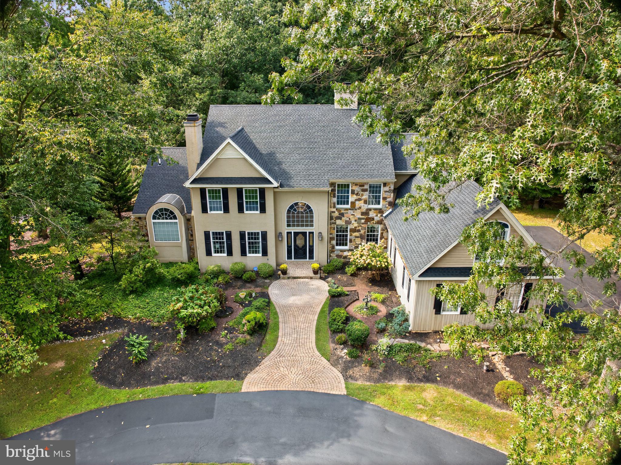 Location. Lifestyle. Community! Welcome home to 1309 Richmond Place a one-of-a-kind residence in the highly sought after Virginia Glen subdivision of Brandywine Ridge! From the moment you arrive, the circular driveway, custom stone facade and grand $25,000 Austrian crystal Shoenbach chandelier set the tone for this exceptional property. Step into this two-story foyer with a sweeping staircase that flows effortlessly into the formal living room with a gas fireplace, and the elegant dining room featuring 3" wood floors and detailed millwork. At the heart of the home, the two-story family great room impresses with a floor to ceiling custom stone gas fireplace, raised hearth seating and two story ceilings. This stunning space opens seamlessly to the custom kitchen with stainless steel appliances, glass front cabinetry, center island with granite counters along with a prep sink and access to the deck perfect for entertaining. The first-floor primary suite is a private retreat, boasting vaulted ceilings, a spa like bath with dual vanities, oversized walk-in shower with dual shower heads and custom tile work along with a large soaking tub to relax at the end of a long day! There are two custom walk-in closets as well as new carpeting throughout the main level of this home. A spacious executive office with a second deck as well as a powder room, mudroom and three car garage wrap up the main level. Upstairs, you will find four generously sized bedrooms and two hall baths, walk in closets including an oversized room with custom built-in shelving. The finished walk-out lower level provides versatile living space with an exercise room, an entertainment area, laundry with abundant storage and more! There are three separate exits to access this amazing space and easy to enjoy the newly added custom slate patio featuring a gas fireplace and hot tub perfect for year round gatherings! Located in the award winning Downingtown Area School District and US News and World Report rated #2 in PA STEM school. This extraordinary home blends timeless elegance with modern luxury... an opportunity not to be missed! Easy access to the R5 train and major routes such as Rt 322,100, 202 and Rt 30. Fabulous restaurants, shopping and more... Welcome Home