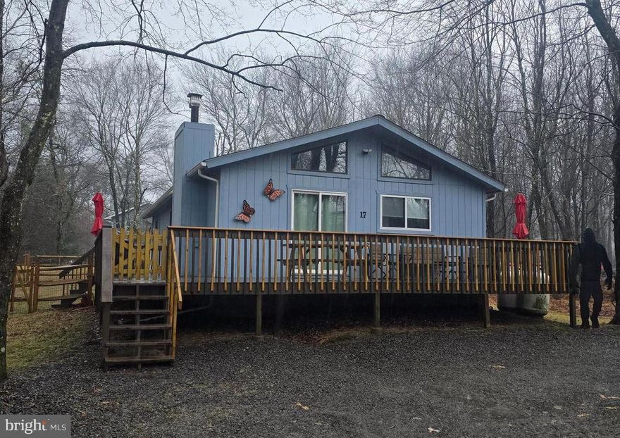 Imagine your own escape, retreat or primary residence tucked away in the private community of Towamensing Trails, where you can golf cart to the lake or clubhouse bar & restaurant, have your own community pool, beach lake and sport courts while enjoying your private residence tucked away on a quiet dead-end non-thru street in the woods.  For under 300k!  Close to Penn's Peak, Jack Frost/Big Boulder, Jim Thorpe and Lake Harmony, and the new turnpike exit at route 903.  Two full bathrooms for your convenience, including one in the primary bedroom.  The popular open layout you desire with kitchen, dining and living area.  Nice large deck in the front plus additional 2nd, covered deck in the back with a hot tub next to it on the patio for those winter nights after snow sports or summer bbq's under the stars.  Fenced in area great for kids and pets.  Plenty of parking.  Don't miss the two videos which accompany this listing- one of which is a property walk thru and watch the other as it illustrates six amazing nearby waterfront bars/restaurants all with a view including three on Lake Harmony and Big Boulder Lake.   Shopping and grocery close by on route 903.   VRBO/AirBnB permitted!