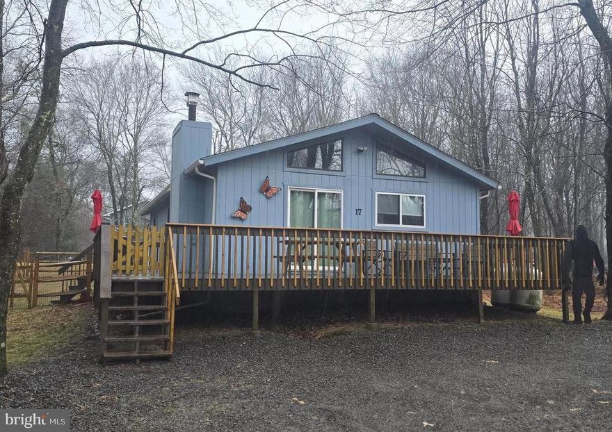 Imagine your own escape, retreat or primary residence tucked away in the private community of Towamensing Trails, where you can golf cart to the lake or clubhouse bar & restaurant, have your own community pool, beach lake and sport courts while enjoying your private residence tucked away on a quiet dead-end non-thru street in the woods.  For under 300k!  Close to Penn's Peak, Jack Frost/Big Boulder, Jim Thorpe and Lake Harmony, and the new turnpike exit at route 903.  Two full bathrooms for your convenience, including one in the primary bedroom.  The popular open layout you desire with kitchen, dining and living area.  Nice large deck in the front plus additional 2nd, covered deck in the back with a hot tub next to it on the patio for those winter nights after snow sports or summer bbq's under the stars.  Fenced in area great for kids and pets.  Plenty of parking.  Don't miss the two videos which accompany this listing- one of which is a property walk thru and watch the other as it illustrates six amazing nearby waterfront bars/restaurants all with a view including three on Lake Harmony and Big Boulder Lake.   Shopping and grocery close by on route 903.   VRBO/AirBnB permitted!