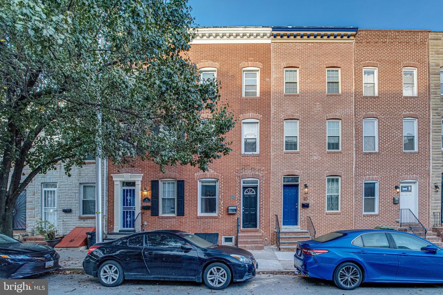 JUST REDUCED! FALL IN LOVE with this BEAUTIFUL 2BR/2FB & 1HB with Den Town Home in Butchers Hill! This cozy home features gleaming hardwood floors throughout, brand new carpeting on stairs, and exposed brick and is conveniently located to Canton, Fells Point, and Patterson Park! Also as a bonus Johns Hopkins Hospital is right up the street! Ample street parking is an added benefit. As you enter, you are warmly greeted by the spacious Living Room offering tons of natural light, gorgeous hardwood floors, and recessed lighting.  Venture into the separate dining room which leads into the Kitchen affixed with new stainless steel appliances, new granite countertops and white cabinets, and while you're there, why not grab a cup of coffee to enjoy on the huge freshly stained deck right off the Kitchen! The upper level offers a spacious bedroom, den perfect for a home office and a full hallway bath. But it doesn't stop there, with an ADDITIONAL level, this home offers a second bedroom, private from the others! With a lower level room, which could be utilized as a Third Bedroom, and Full Bath, this home is great for having guests spend the night! You know you want to see inside! Schedule a private showing today!