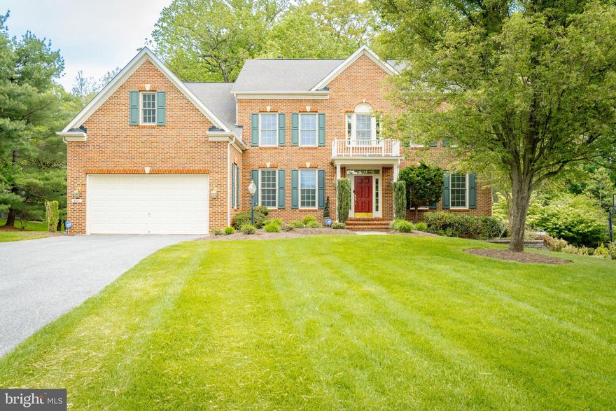 Welcome to this exquisite custom brick estate, boasting over 5,600 square feet of impeccably finished living space spread across four expansive levels. Tucked away against a backdrop of serene woods, this 6-bedroom, 5.5-bath residence seamlessly blends timeless sophistication with modern comfort.

The main level showcases a generously sized, open-concept kitchen—pristine and meticulously maintained.  With extensive cabinetry and a sun-drenched breakfast nook encircled by windows, it provides an enchanting, treehouse-like setting for morning coffee or casual dining.

The upper level is anchored by a lavish primary suite featuring a gracious sitting area and a private office—your own personal sanctuary. Two additional bedrooms share a Jack-and-Jill bath, while a third includes its own en-suite, perfect for family or guests. The top level offers a rare and versatile retreat: fully finished with a spacious bedroom, living area, and full bath—ideal for a guest suite, studio, or executive office.

The walkout lower level elevates the home’s appeal even further, offering a sprawling finished space complete with a private bedroom and full bath—ideal for entertaining, multi-generational living, or a luxury fitness suite.

Outdoors, experience refined relaxation on the expansive deck or elegant stone patio, framed by professionally landscaped grounds, mature trees, and your own tranquil pond—a hidden gem that elevates the entire setting to a resort-like experience.

An spacious two-car garage with EV charger and oversized driveway provide ample parking and convenience.

This residence boasts with two gas fireplaces—one creating a warm ambiance in the family room, and the other offering a touch of luxury in the serene primary suite.

Every inch of this residence has been crafted with care and maintained with pride—a rare opportunity for those seeking space, privacy, and enduring quality in a truly distinguished home.