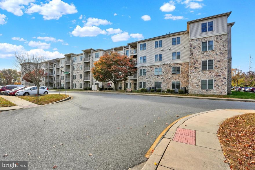 Welcome to this refreshed & immaculate 3rd-floor corner end unit in a highly desirable 55+ community. Located minutes from the The Grove Shopping Center, which includes an Acme, plenty of shopping & dining experiences. Enjoy the close proximity to the Newark Senior Center & all the activities you can choose from each day if you would like.  Nearby University of Delaware & Downtown Newark Main Street provide for a vibrant community life.  Spend summer days relaxing at the outdoor pool or take part in Social Clubs and Community Events year round.  As you step inside, you’ll immediately appreciate the spacious & sunlit feel, with the 9-foot ceilings that add an open, airy atmosphere throughout. The sunlit Living Room features a slider to your private balcony with a peaceful view of open space. There’s also a cozy alcove perfect for a desk, hobby or craft area.  There is ample space for a dining table, making it ideal for entertaining or quiet meals.  The kitchen island w/two-tiered counters with room for Seating, has a double bowl sink and the dishwasher.  Neutral countertops, white appliances, tall cream colored cabinets, built in microwave all accented by honey colored flooring.  Convenience is key in this home, with a foyer that includes a coat closet and a full walk-in pantry. The pantry is well-equipped with a stand-up freezer, washer and dryer, and plenty of storage racks for all your pantry items.  The owner’s suite boasts a distant view of the community swimming pool and open spaces. It features a large walk-in closet and a spacious bathroom with a double-bowl vanity, tiled floors, a linen closet and a step-in shower with two built-in bench seats. Two additional bedrooms, each with ceiling fans and large walk-in closets, provide plenty of room for guests or additional living space. The Full Hall Bathroom is generously sized, offering a tub/shower combination, tiled floors, and a comfort-height vanity.  For extra storage, just steps from your front door is a large private storage closet for Unit 316, offering ample space for seasonal items or other belongings.  This inviting, sparkling clean residence is priced to sell quickly and offers an unbeatable combination of comfort, convenience, and community. Don’t miss the opportunity to make this beautiful home yours and take advantage of an amazing value in this sought-after senior community!
