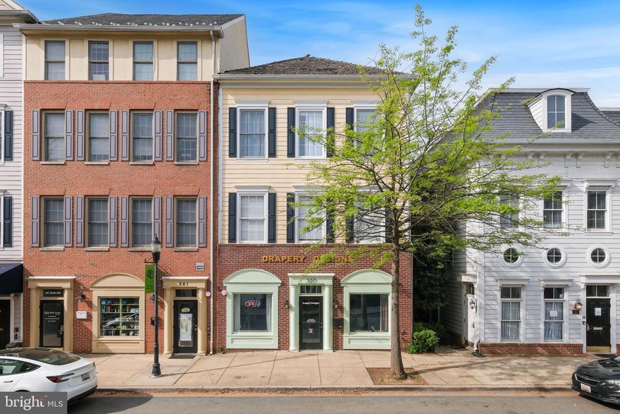 Located in the heart of Kentlands Midtown, this exceptional commercial building offers both stability and flexibility for investors or owner-occupants. The first-level retail space is currently home to Drapery Designs, a well-established tenant known for maintaining a clean, organized showroom — and will remain in place after settlement, providing immediate rental income.

Above the retail suite sits a charming one-bedroom, one-bath apartment with its own address at 336 Main Street. The residence features a private garage and can serve as an ideal owner’s unit or an additional income-generating rental.

Set amid the vibrant core of Kentlands’ retail and dining district, this property offers unbeatable proximity to restaurants, boutiques, and Whole Foods. With its mix of residential and retail use, prime visibility, and consistent revenue potential, this building represents a rare investment opportunity in one of the area’s most desirable mixed-use communities.