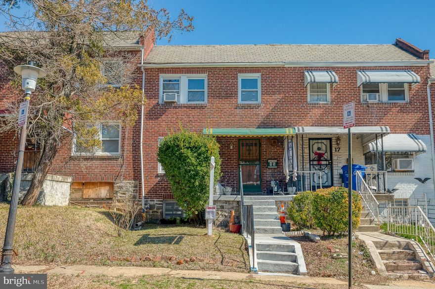 Welcome to this 3-bedroom, 2-bath brick-front townhome in Baltimore’s Carroll-South Hilton community, offering a rare combination of space, modern updates, and convenience. A brand-new roof (2025) and two new exterior rear doors (2025) enhance both durability and efficiency, while the attached garage and concrete driveway provide the luxury of private, off-street parking—an uncommon find in the area. A covered front porch leads into a bright living and dining area with laminated flooring, flowing into a galley-style kitchen with ceramic tile flooring. Just off the kitchen, a rear upper balcony offers a quiet outdoor retreat. Upstairs, all three bedrooms feature original hardwood floors and ceiling fans, while the full bath, remodeled in 2022, showcases ceramic tile flooring, a walk-in shower, and a striking statement sink that adds character and style. The lower level expands the living space with a recreation room featuring vinyl flooring and wood paneling, a second full bath with a walk-in shower, and a laundry area. Out back, a covered patio provides a shaded space to relax, leading to a partially fenced, grassy yard—perfect for outdoor activities, gardening, or pets. With thoughtful updates, private parking, and timeless charm, this home is a fantastic opportunity. Conveniently located near shopping, dining, and commuter routes, it’s ready for its next chapter.